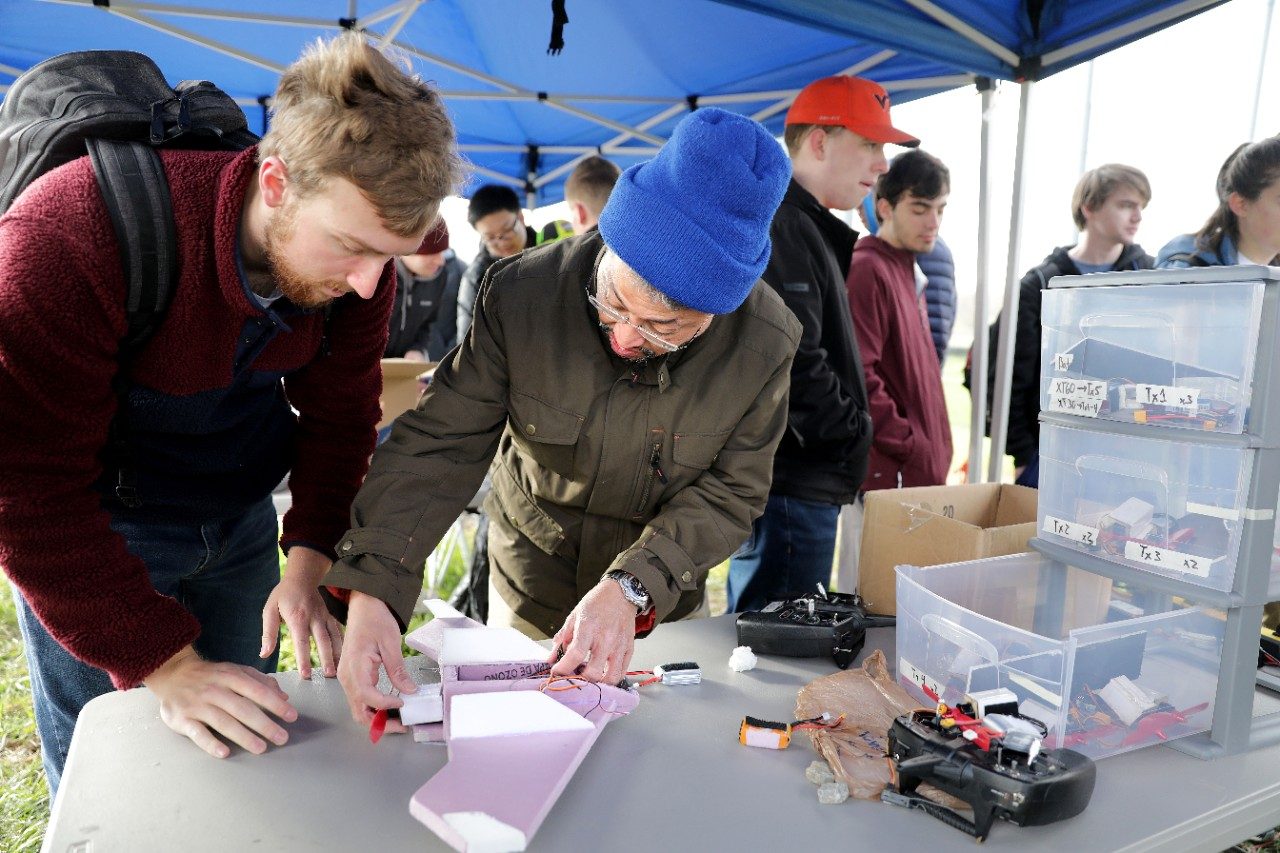 Michael Butler, an associate professor of practice in the Department of Engineering Education, helps a student with a design for a lightweight, inexpensive drone (Virginia Tech)