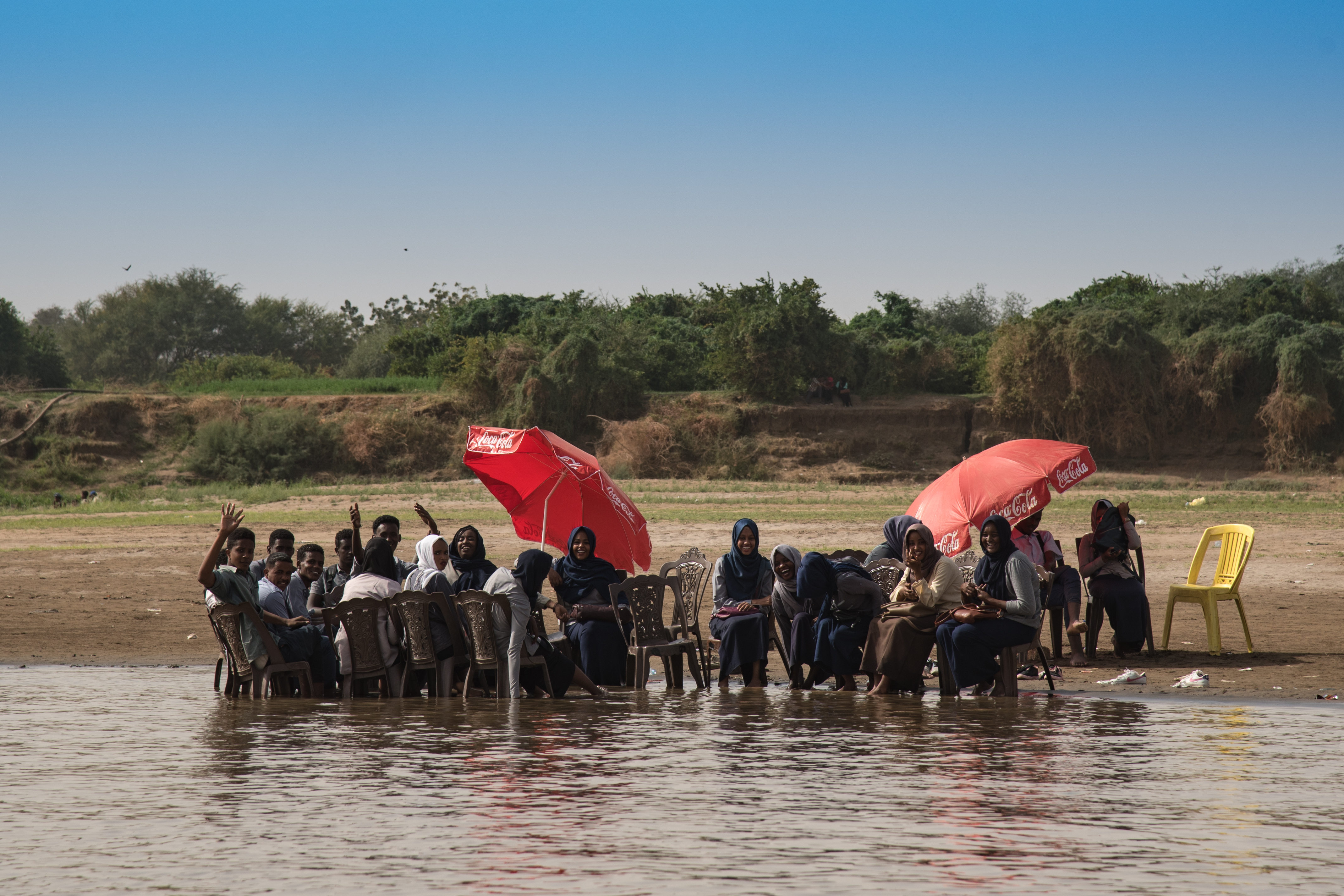 Teenagers socialise on the banks of the Nile in Khartoum (Sarah Marshall/PA)