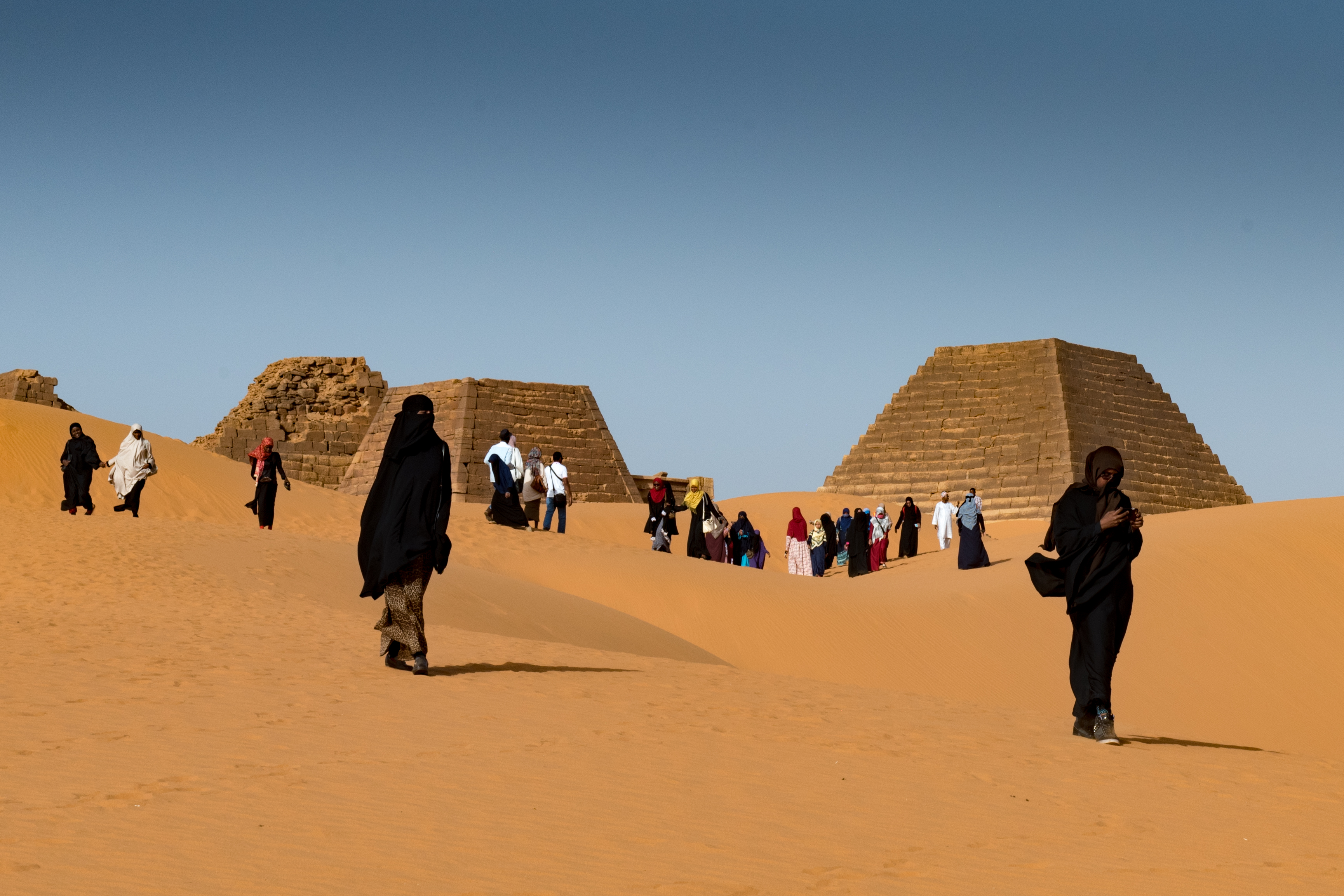 Sudanese tourists visit the pyramids of Meroe (Sarah Marshall/PA)