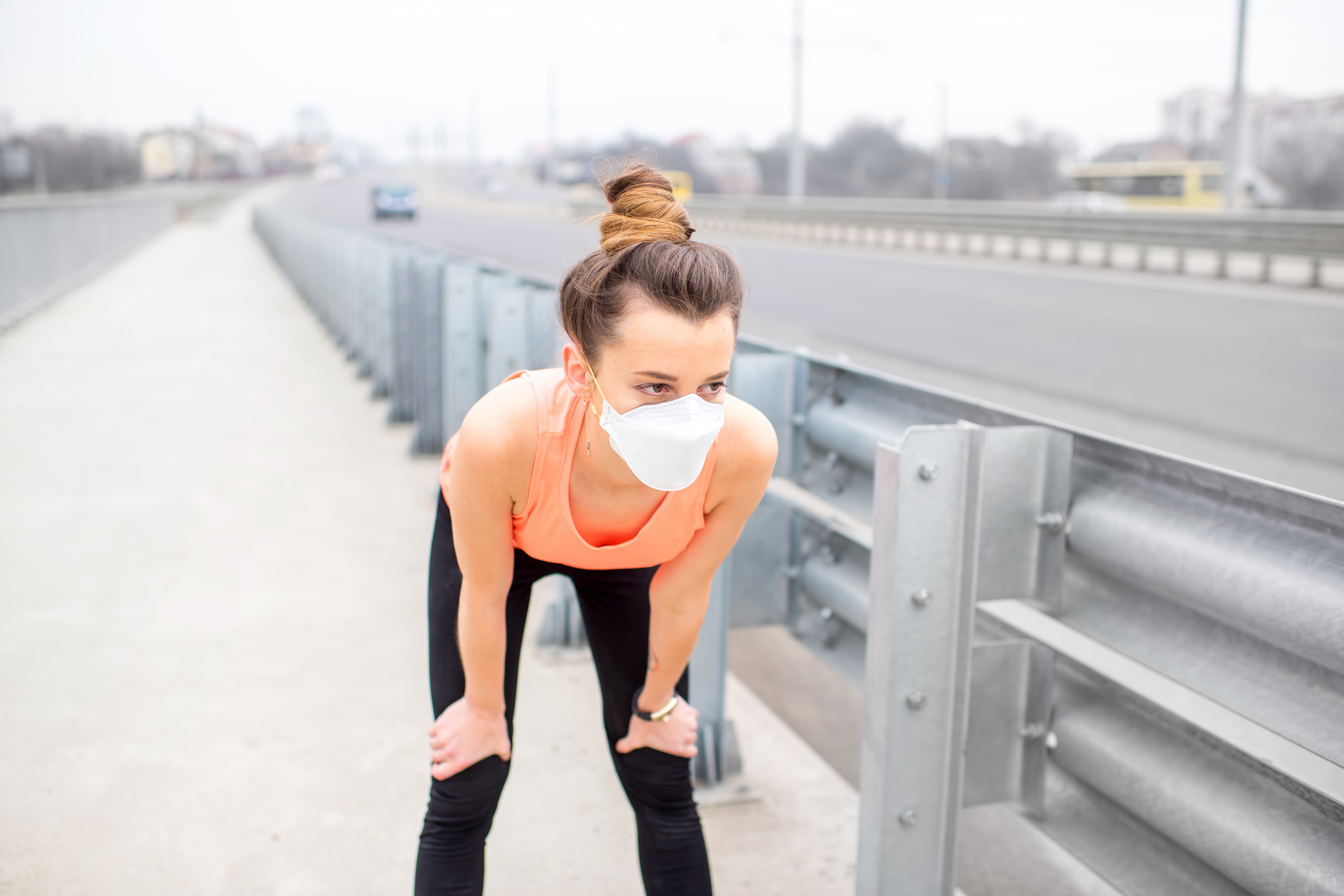 Woman exercising with protective mask
