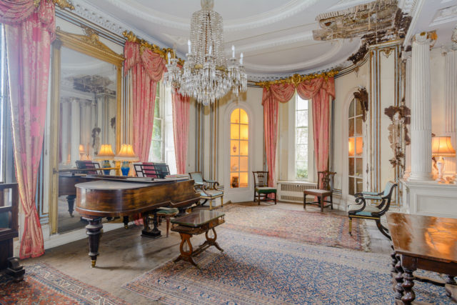 The eight-bedroom mansion boasts large rooms, two kitchens, one described as being in 