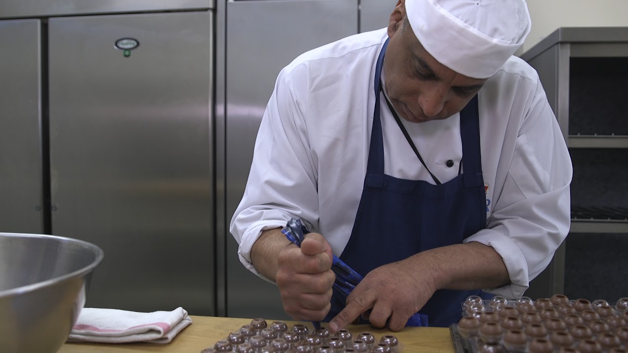 Pastry chef Selwyn Stoby, who will be helping to create the royal wedding reception menu, shows off his chocolate truffle making skills (Renee Bailey/PA)