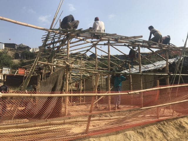 Placing sandbags on the roof of a house (Jemma Crew/PA)