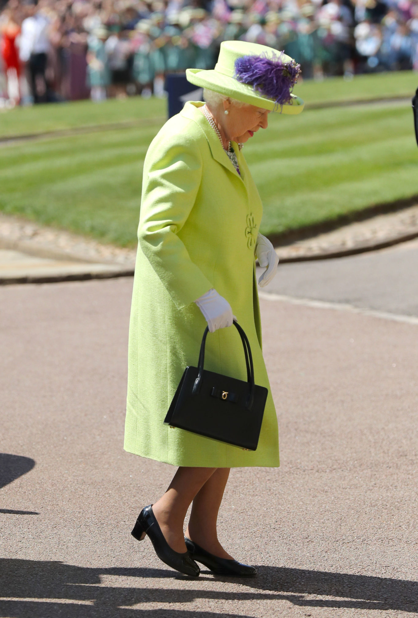 Next came the Queen in a bright green outfit (Gareth Fuller/PA)