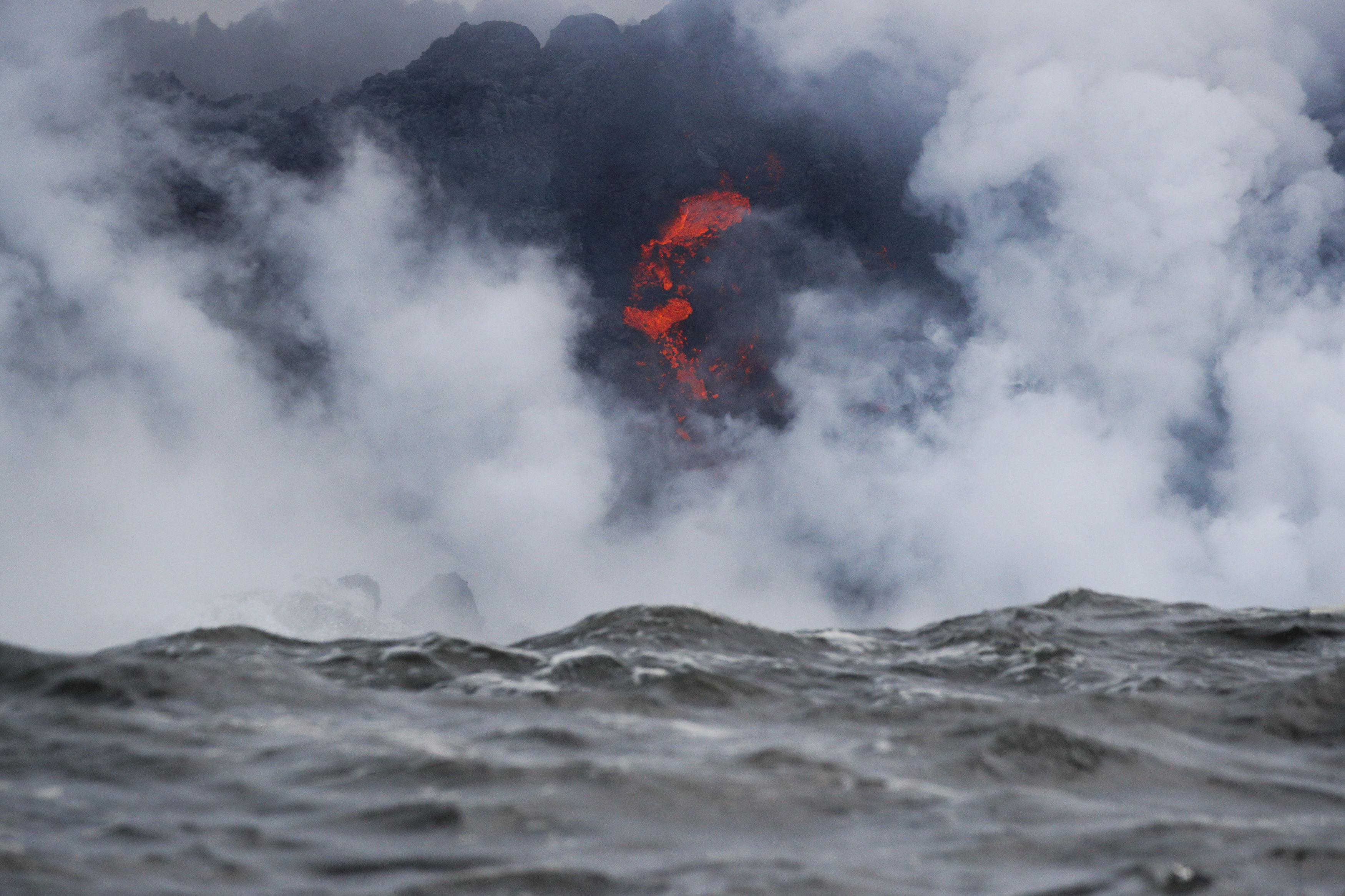 Lava flows into the ocean near Pahoa (Jae C Hong/AP)