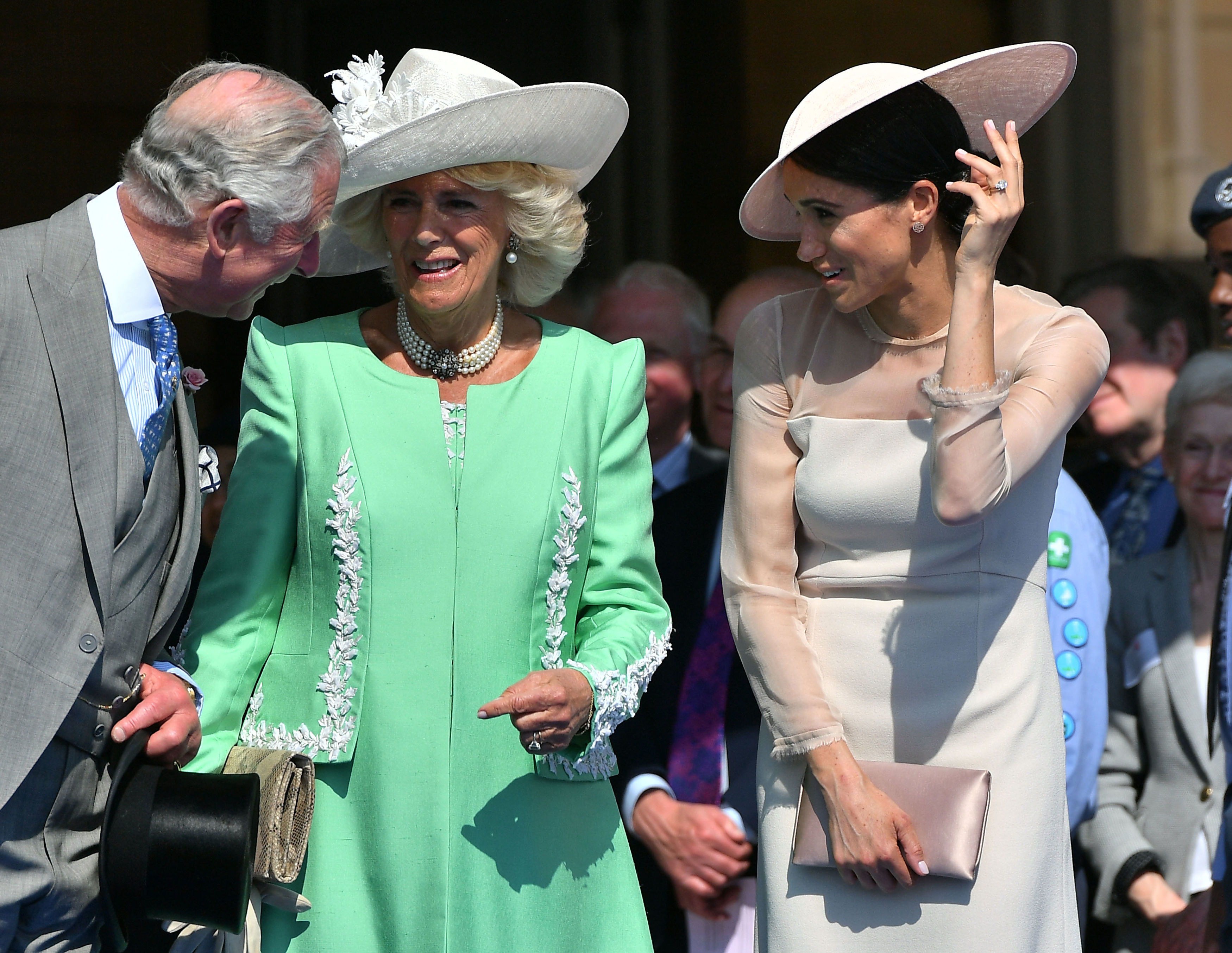The Prince of Wales shares a joke with the Duchess of Cornwall and his new daughter-in-law (Dominic Lipinski/PA)