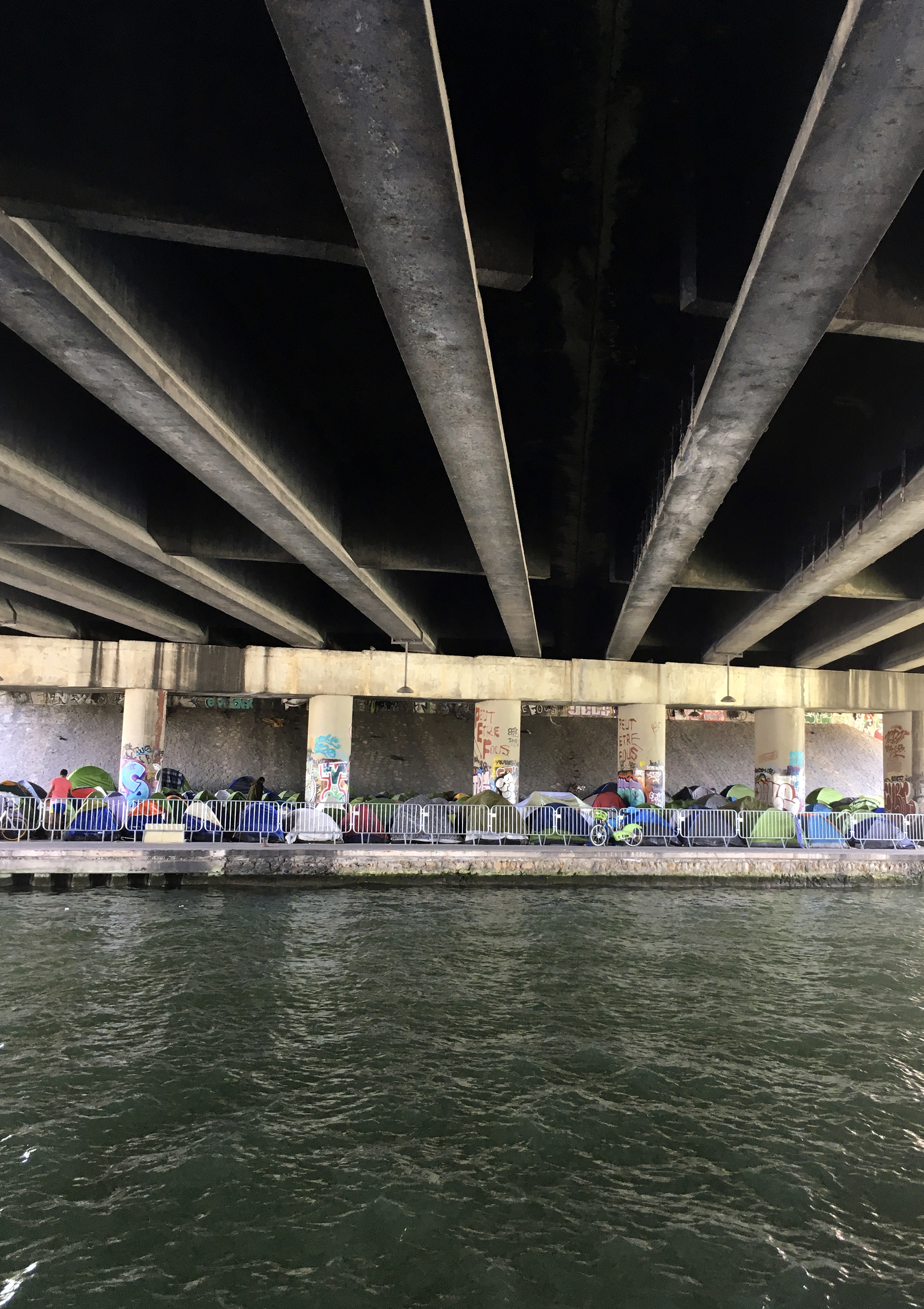 Migrants camp under a bridge in Paris 