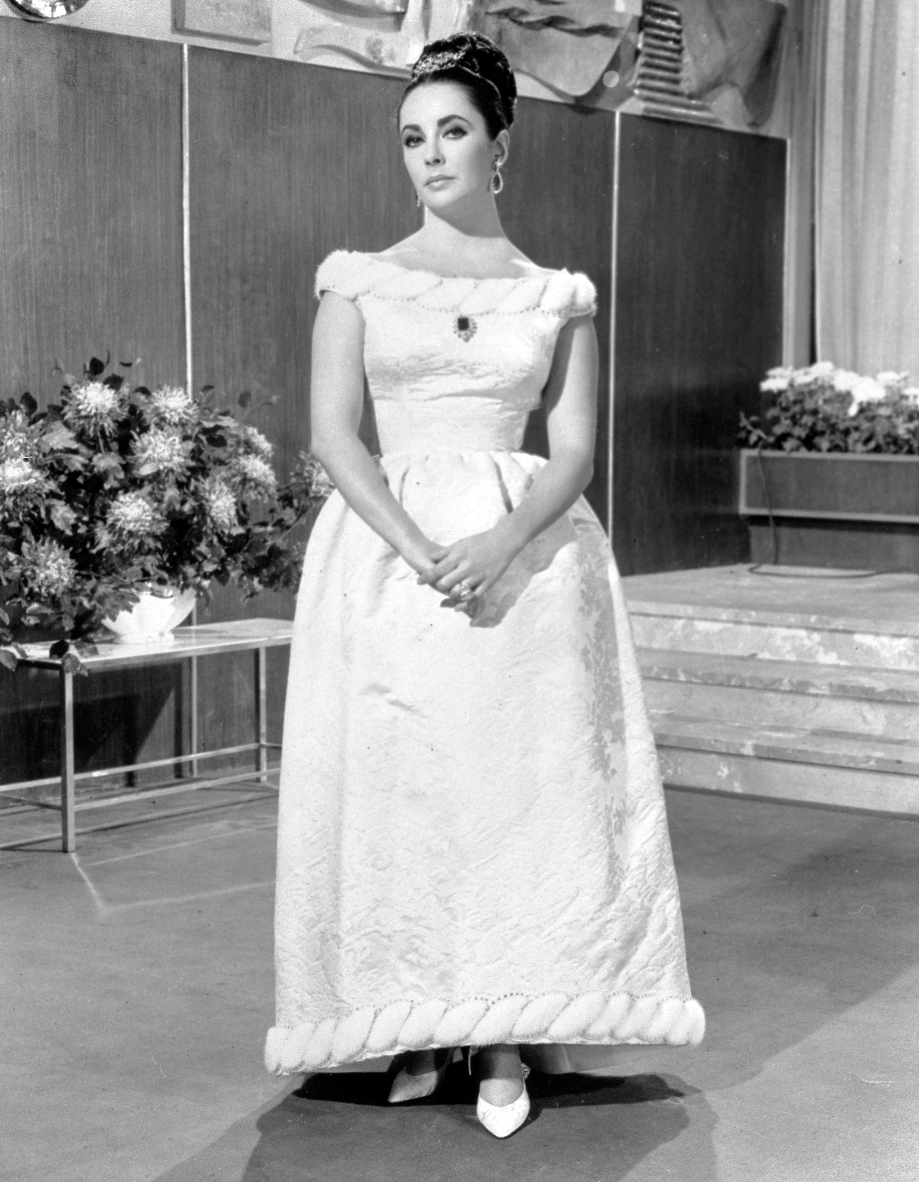 Actress Elizabeth Taylor dressed in a Givenchy ball gown in 1963