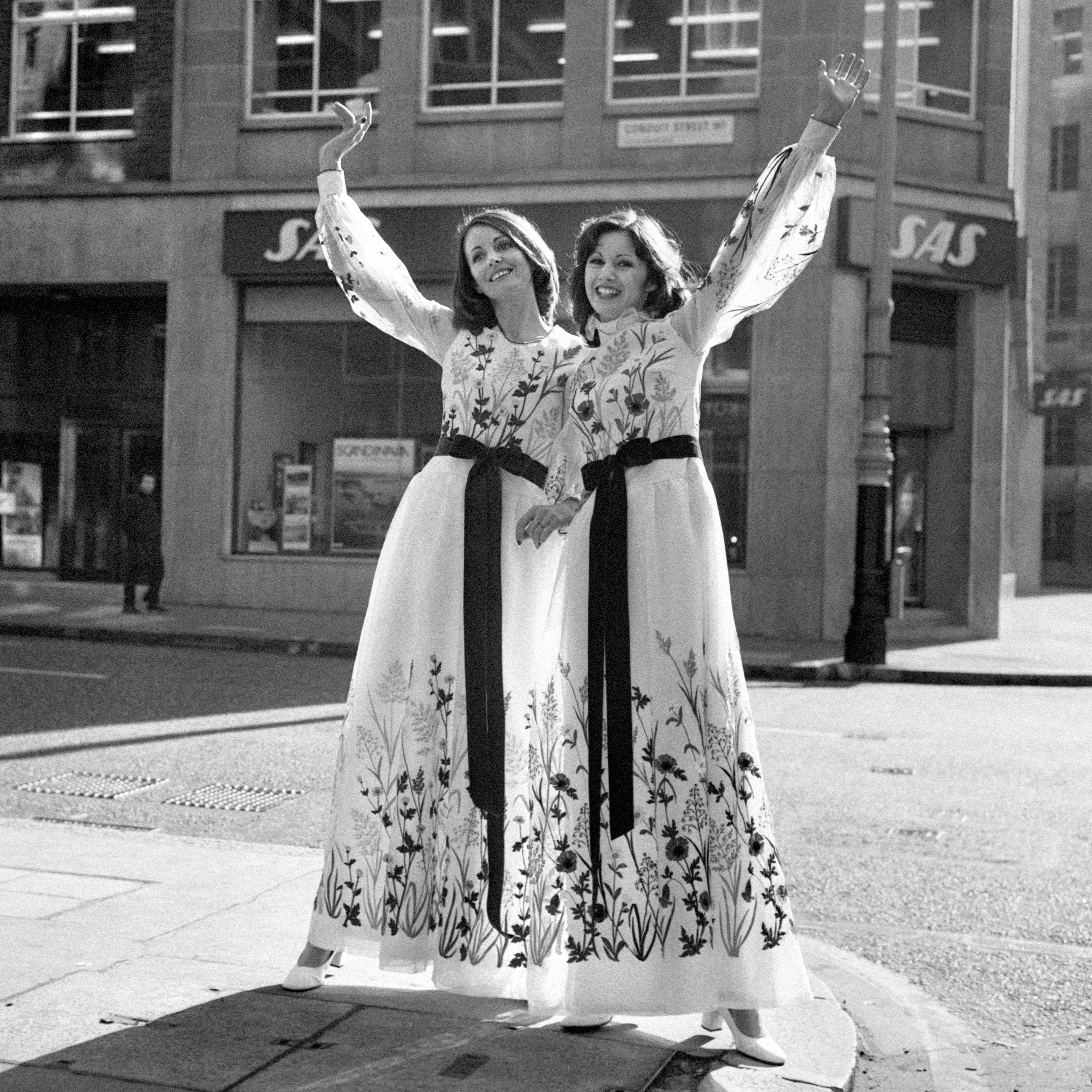 Designed by Jorn Langberg, the theme was the English countryside in summer, and stopping traffic in these evening gowns are Suzan Tapper (left) and Sharon Marcus in 1973