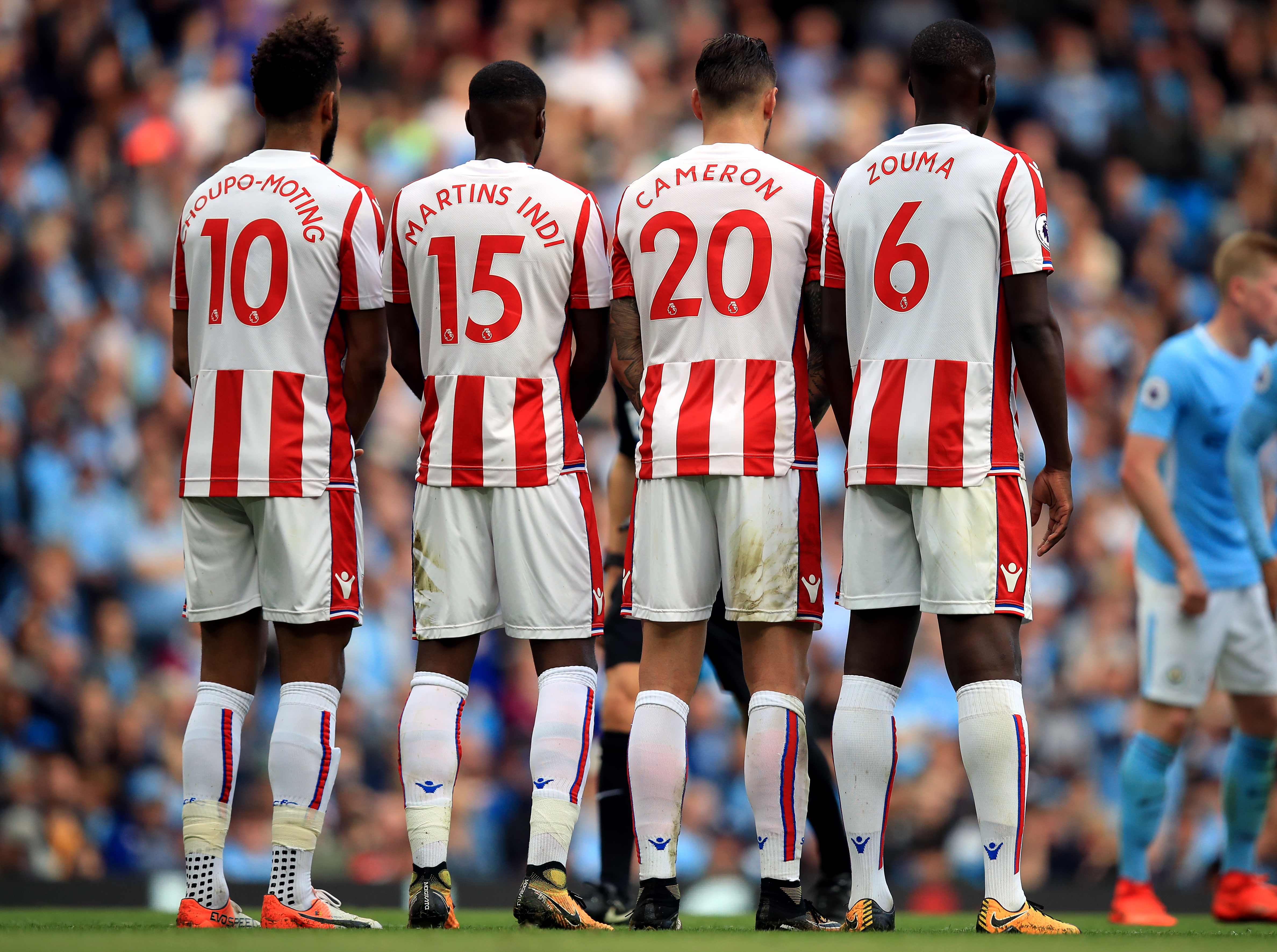 Stoke City footballers form a wall for a free-kick