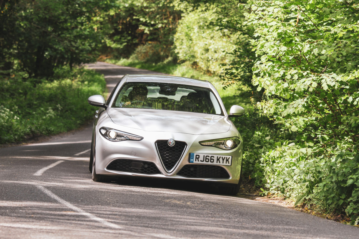 The Alfa's quick steering takes a little getting used to