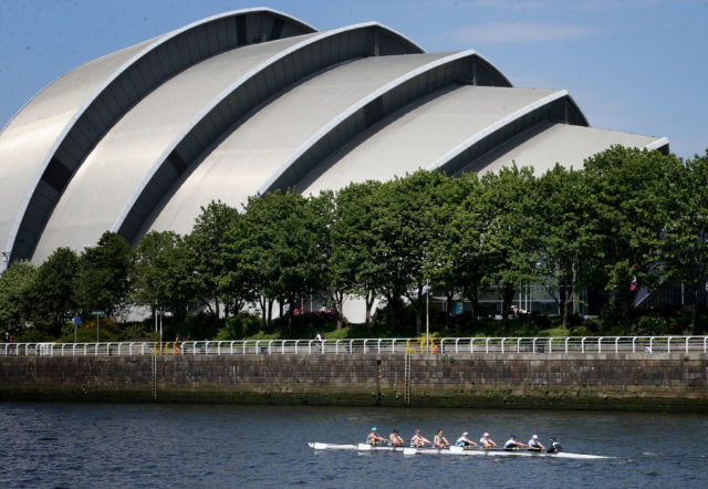 The crew of the women's eight from the University of Edinburgh pass beneath the Armadillo on the River Clyde in Glasgow )Jane Barlow/PA)