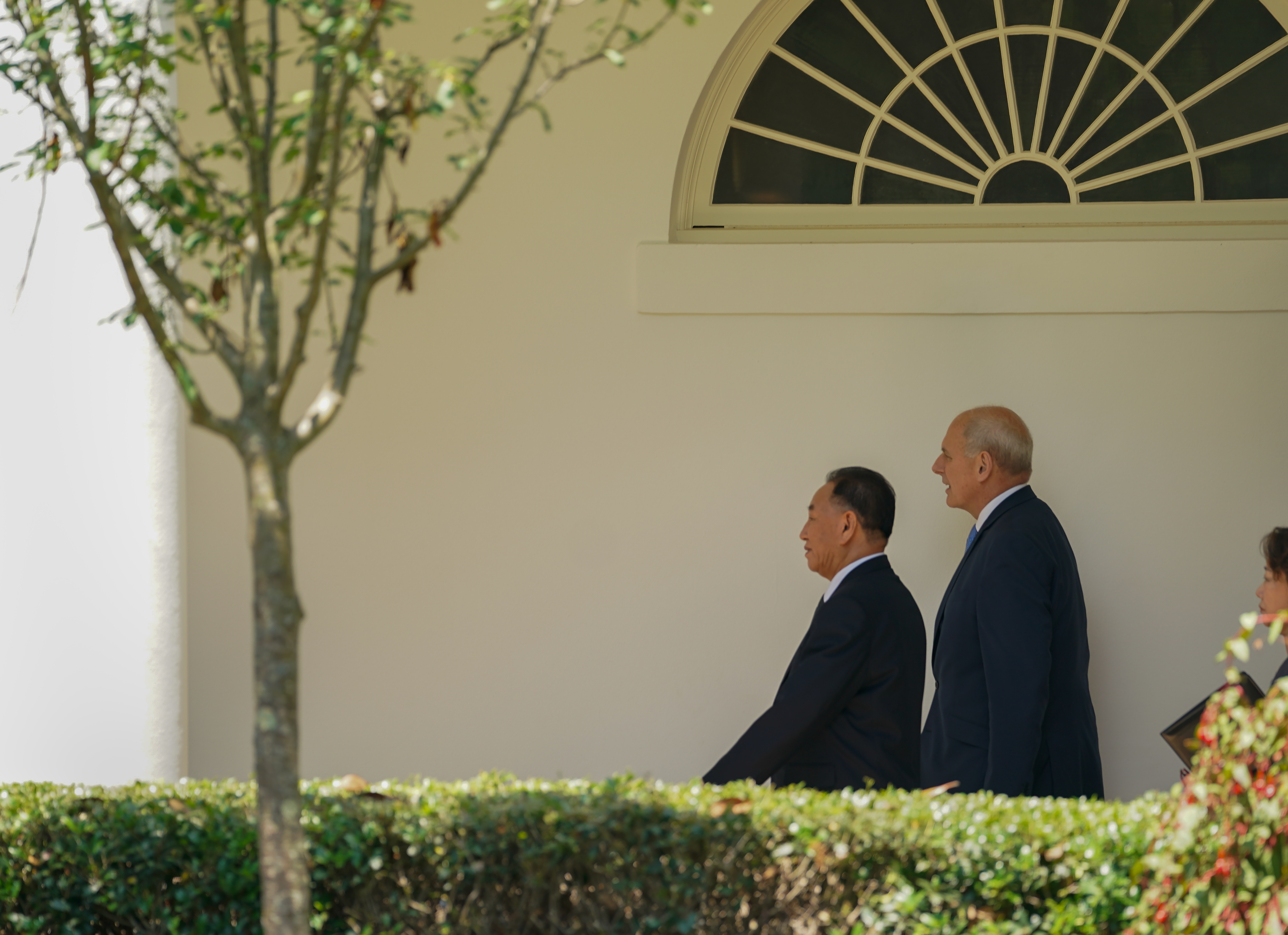 US chief of staff John Kelly walks towards the Oval Office with Kim Yong Chol