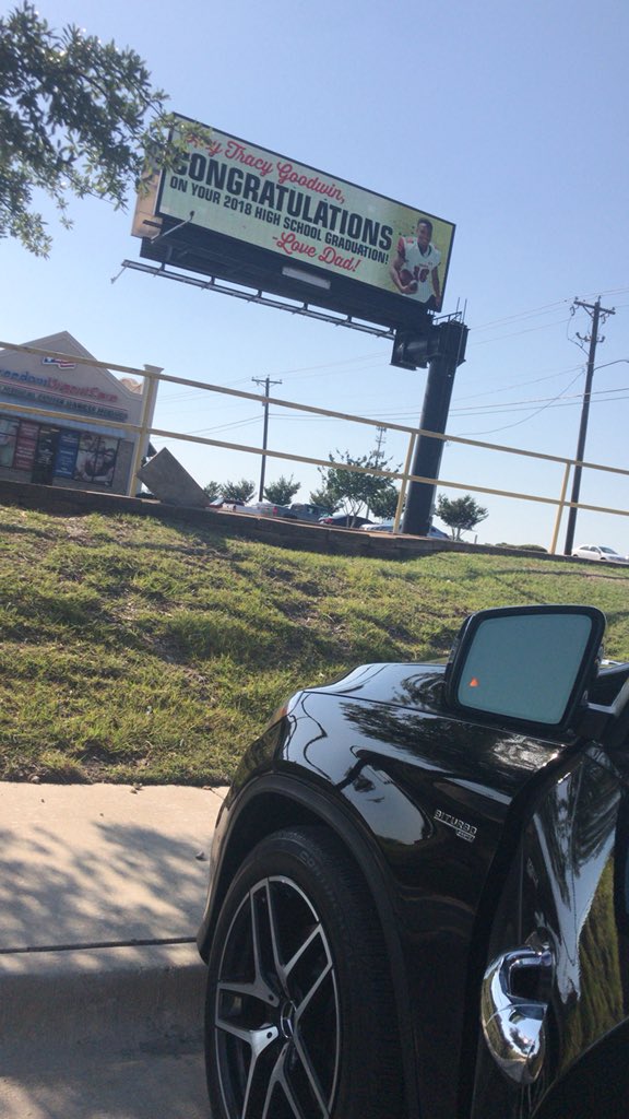 The billboard with Tracy wearing football kit