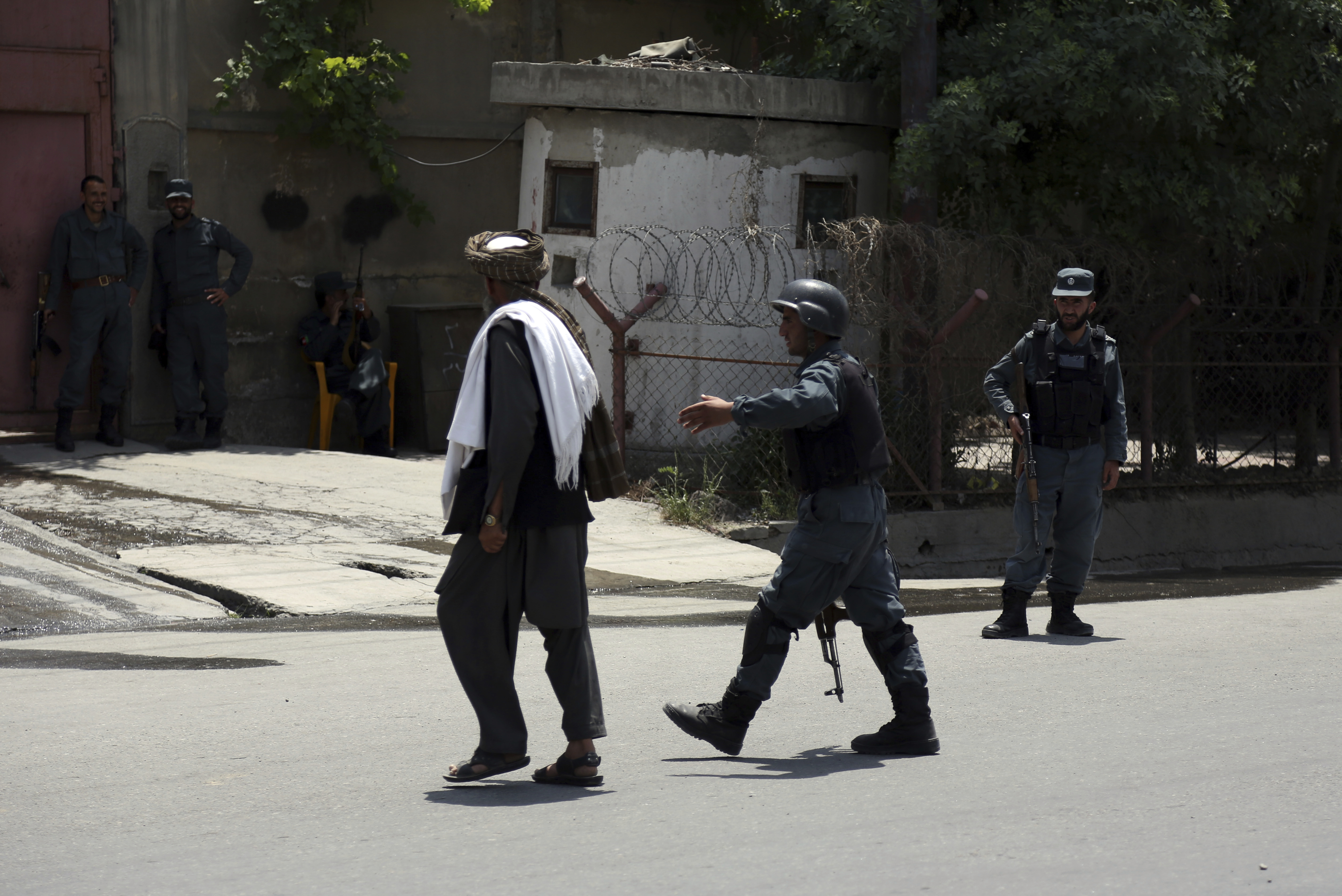 Security personnel at the site of a deadly suicide attack in Kabul
