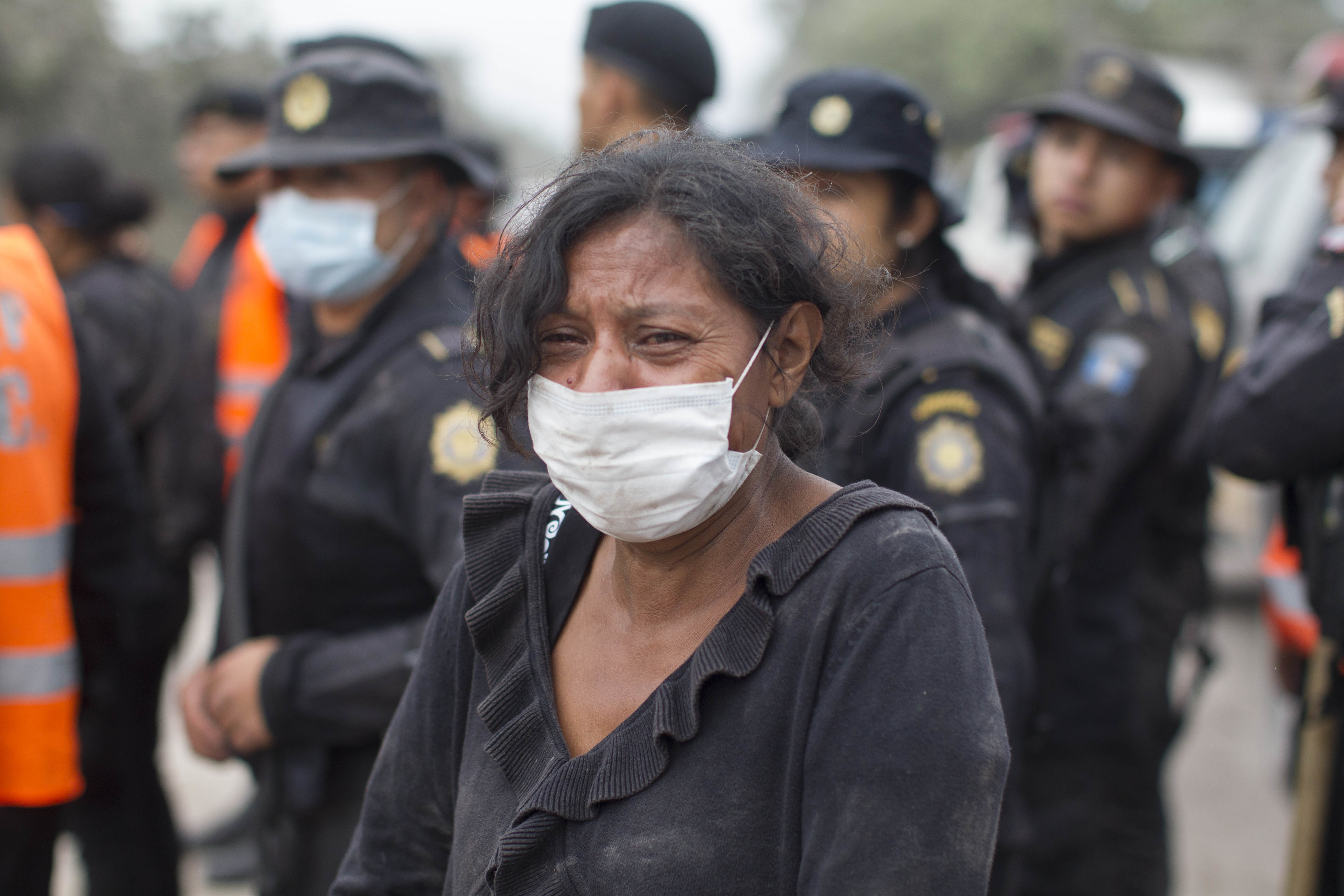 A resident cries after she was safely evacuated