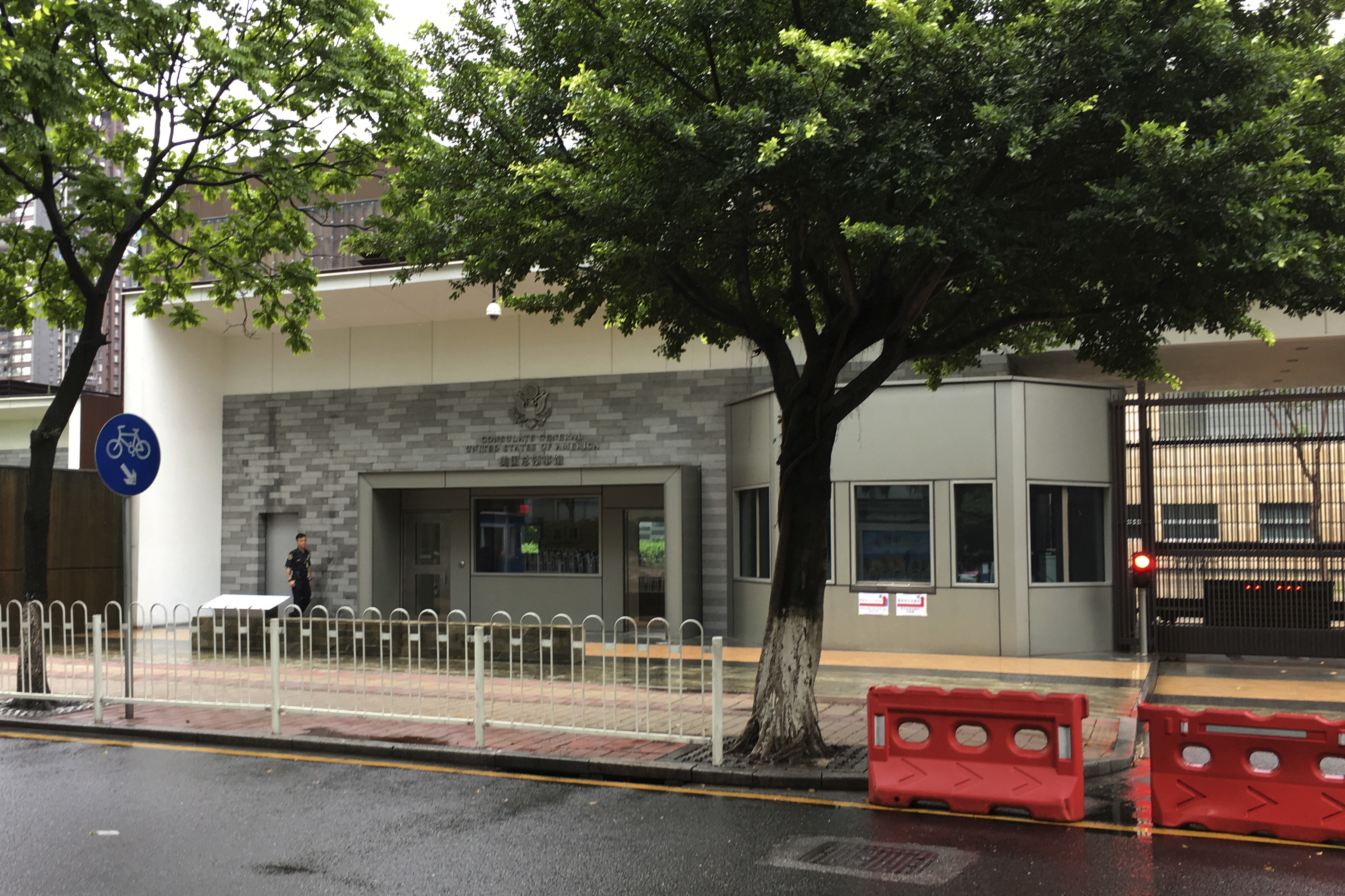 A security person outside the US consulate building in Guangzhou