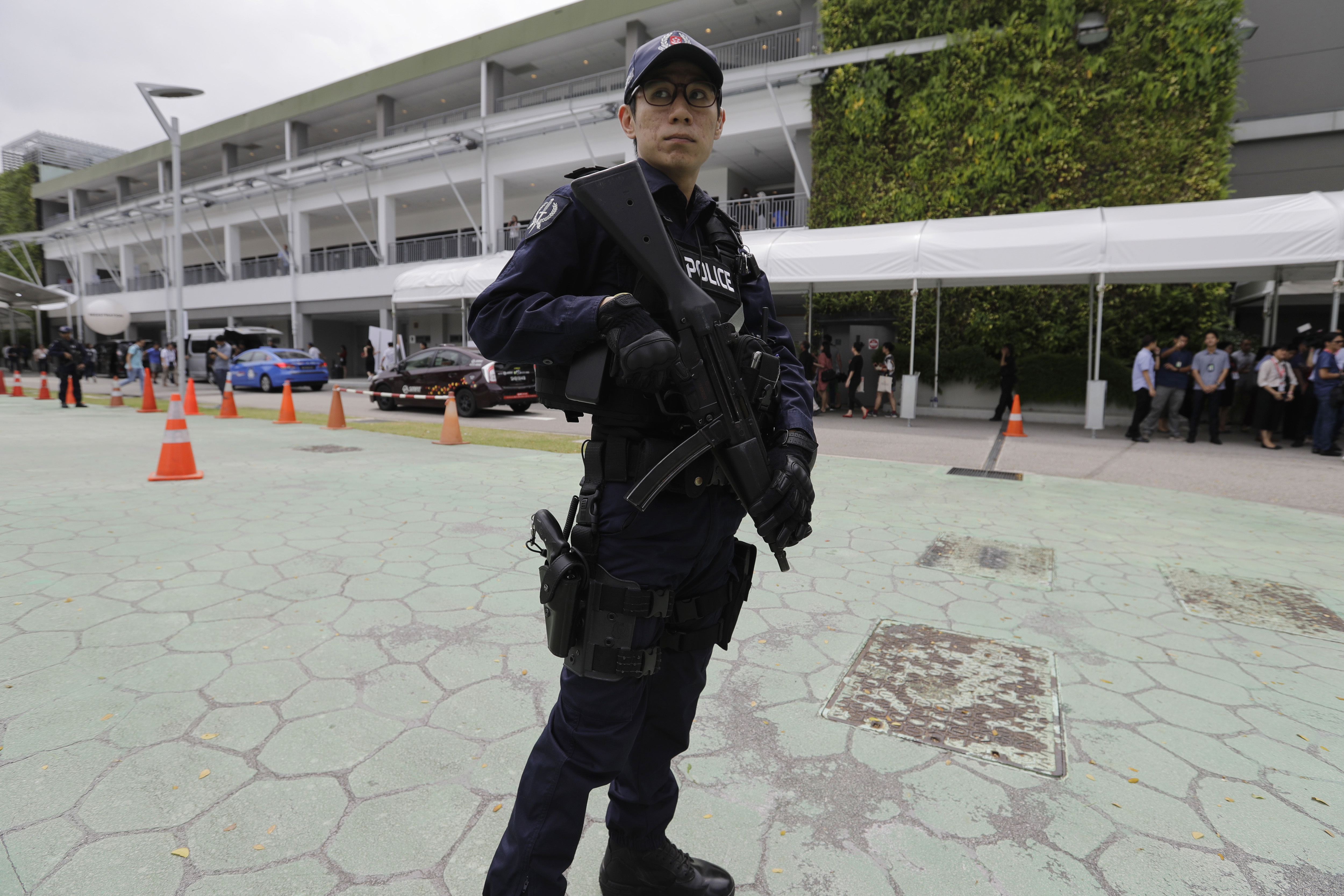 A police officer guards the entrance of the international media centre in Singapore