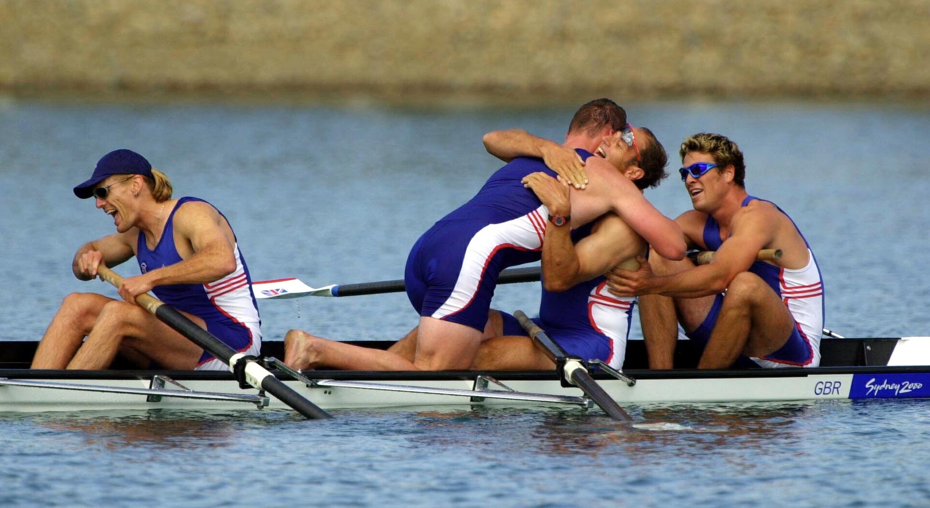 Great Britain rowers (left to right) Tim Foster, Matthew Pinsent, Steve Redgrave, and James Cracknell celebrate after winning the Gold Medal in the Men's Coxless Four Final at the Olympic Games in Sydney in 2000 (Toby Melville/PA)