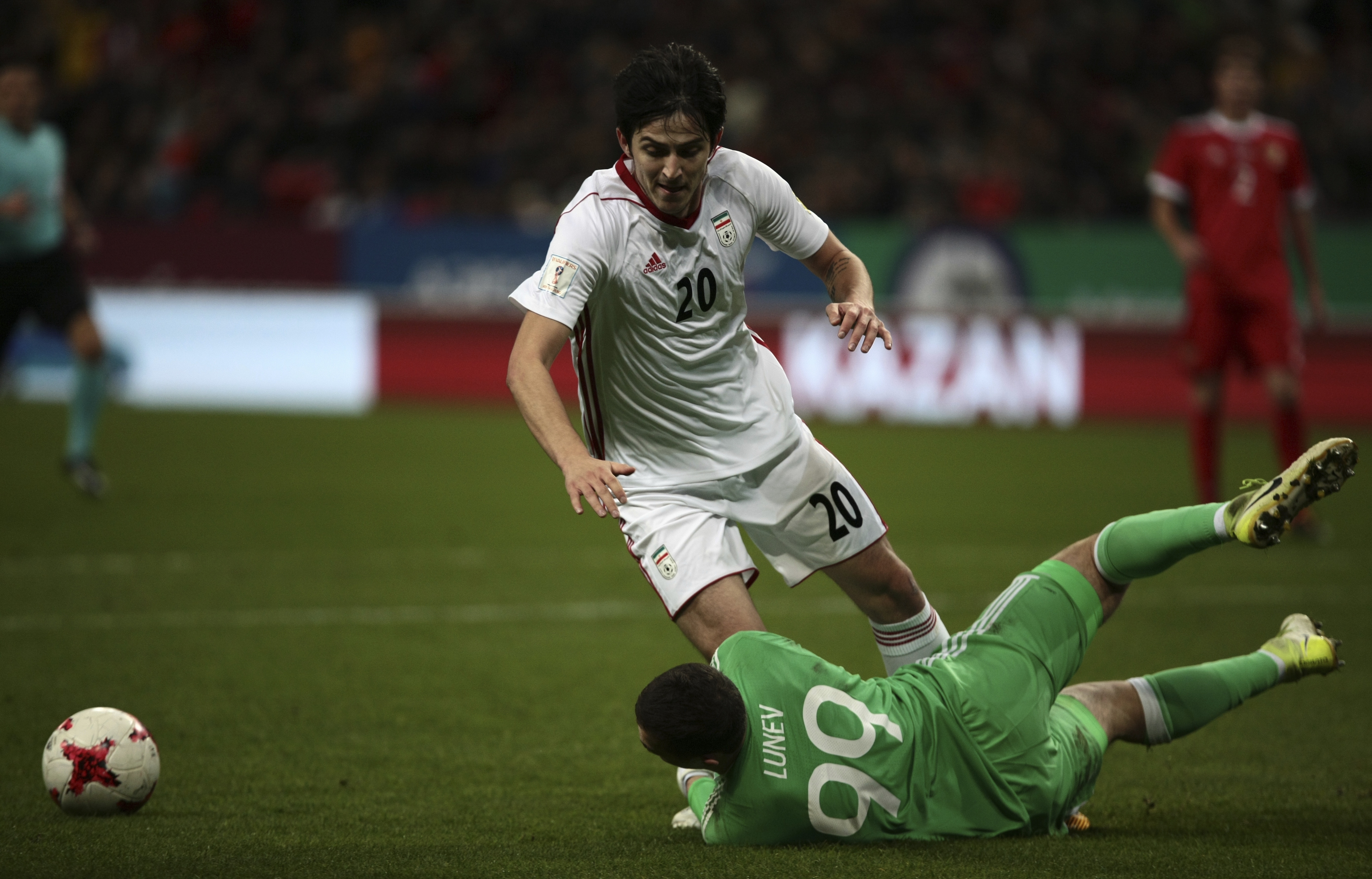 Iran's Sardar Azmoun plays in a football match against Russia