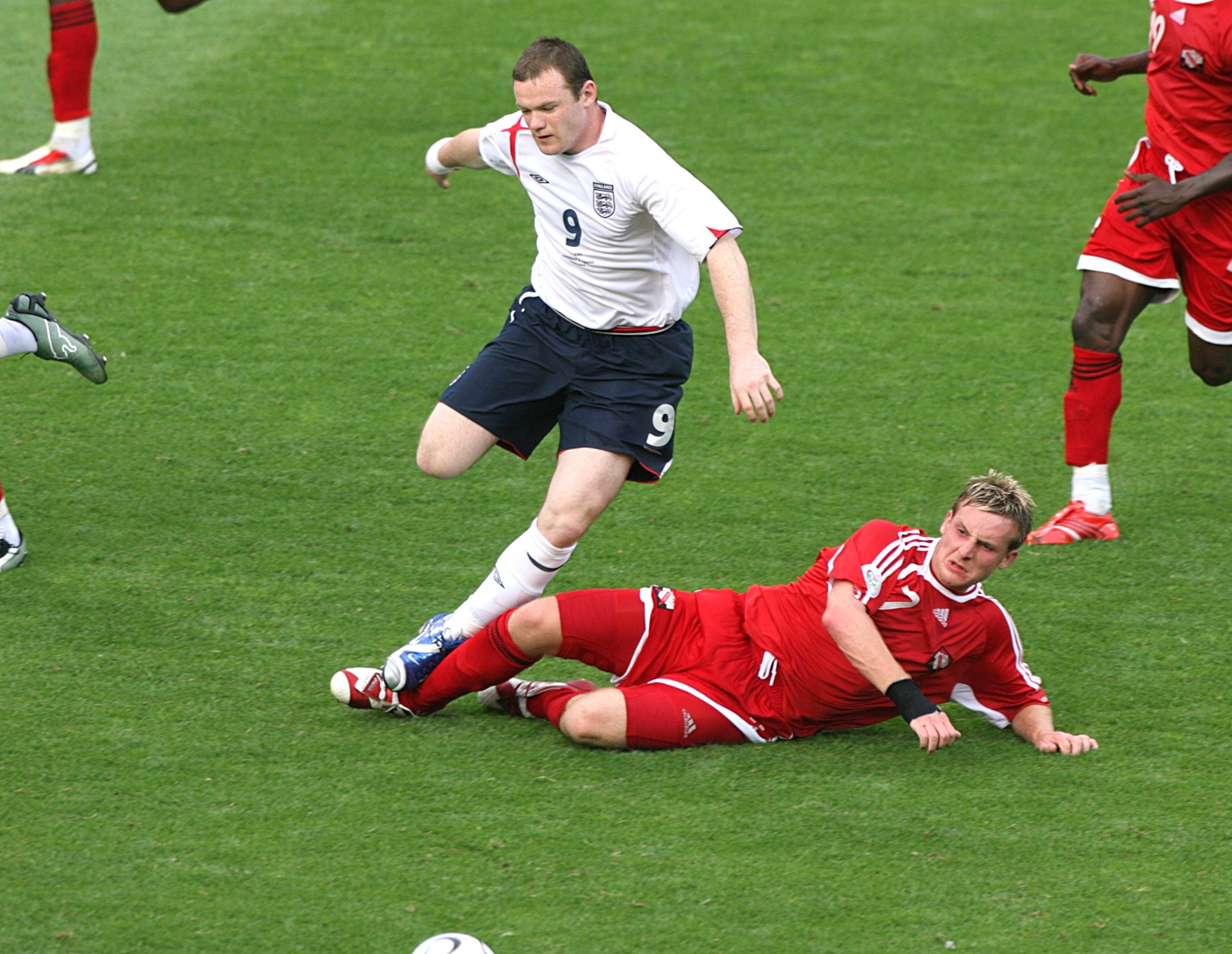 Wayne Rooney and Trinidad and Tobago's Chris Birchall battle for the ball