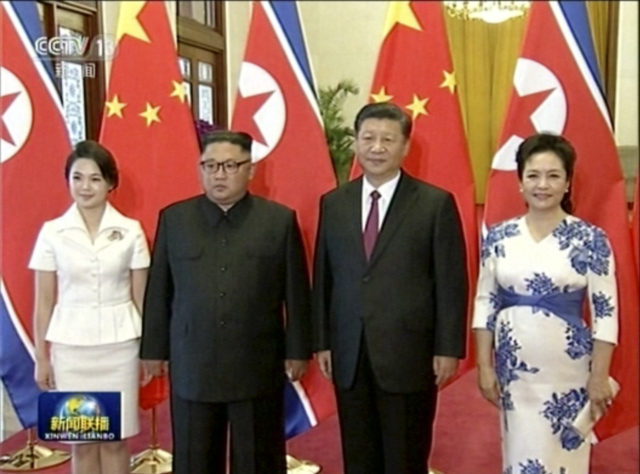 Xi Jinping and his wife Peng Liyuan with Kim Jong Un and his wife Ri Sol-Ju