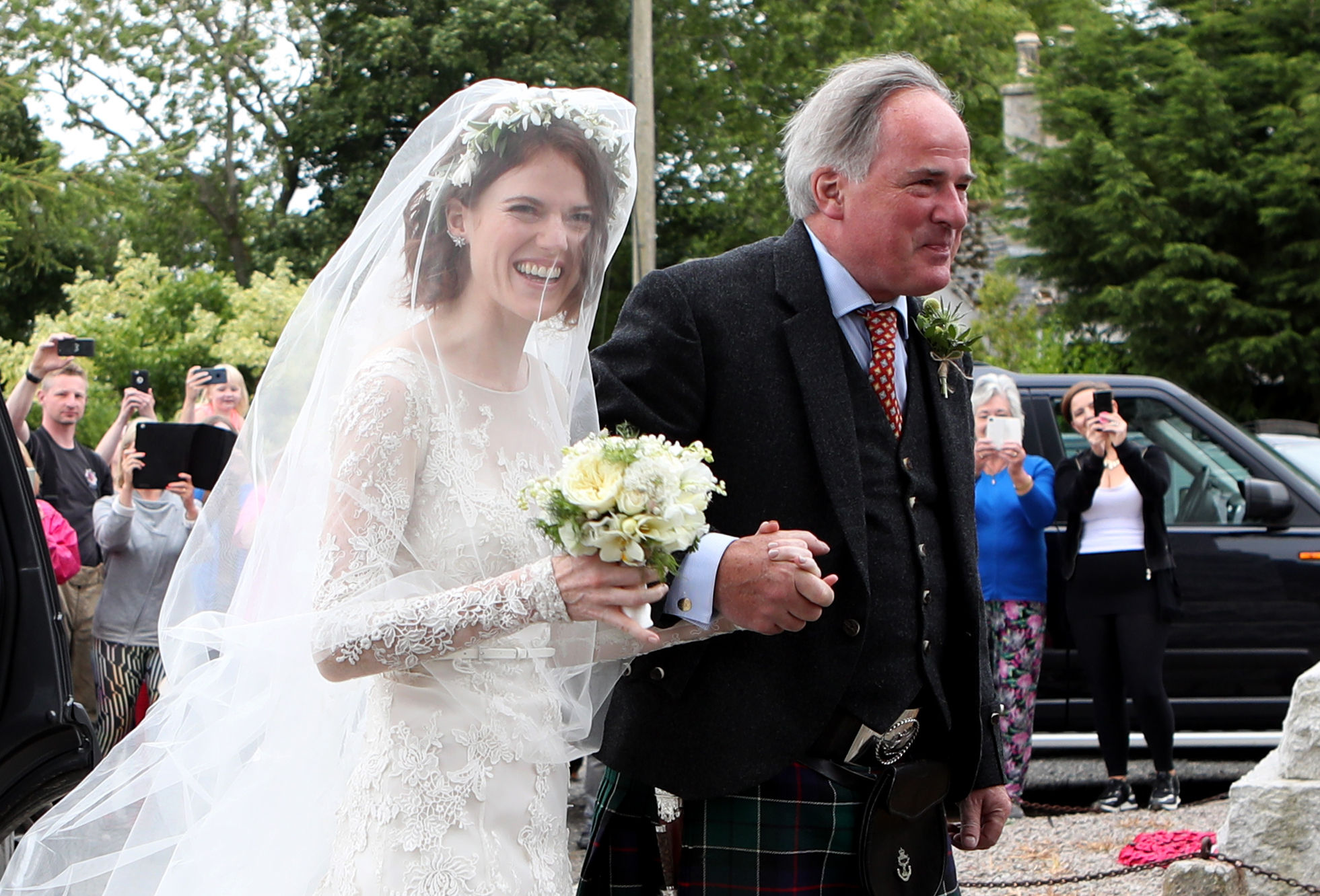 Rose Leslie with her father Sebastian arrive at church