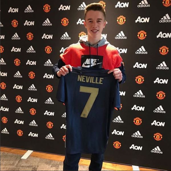 Harvey Neville poses with his United shirt