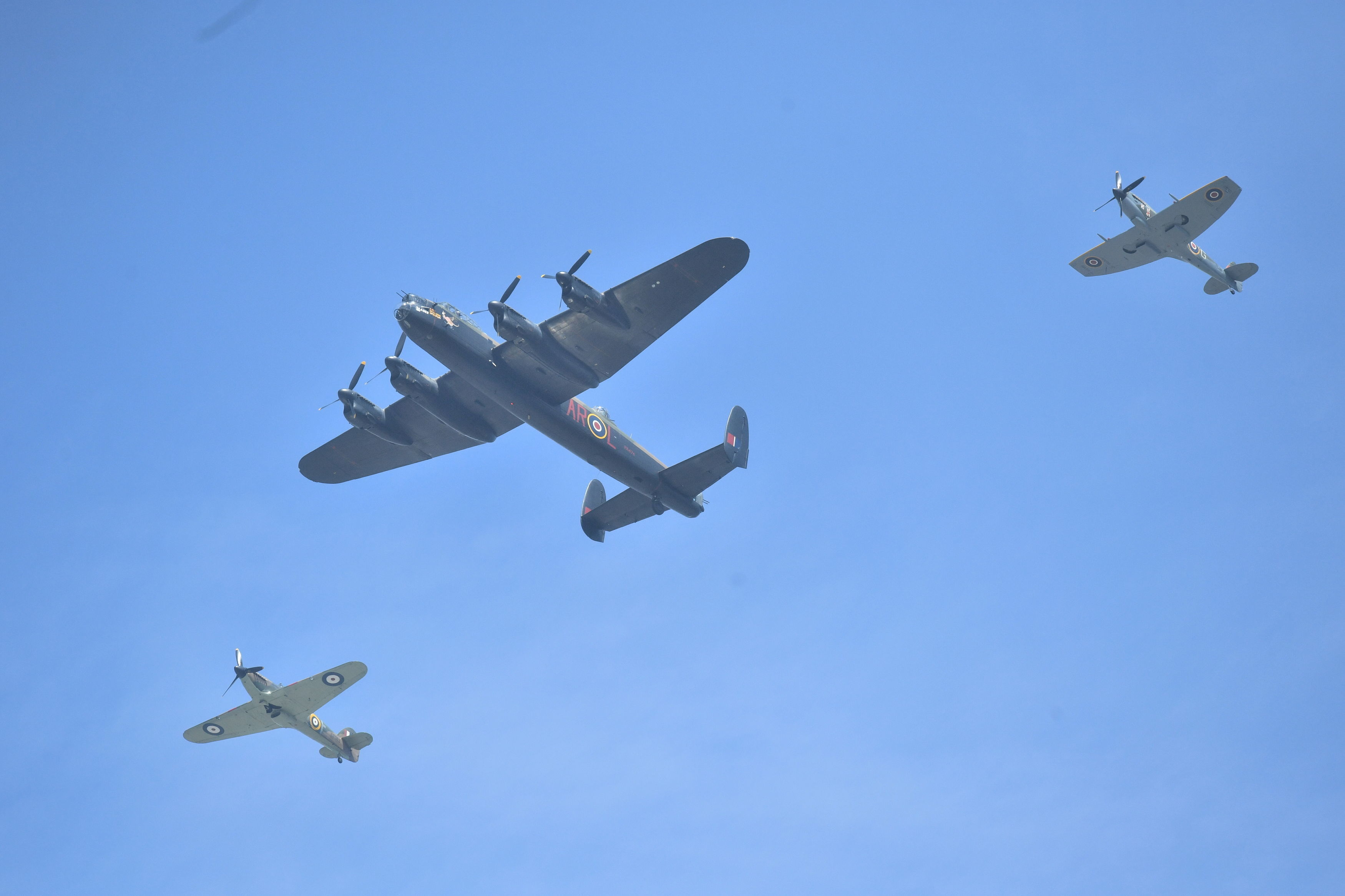 Spitfires escort a Lancaster during a flypast over Buckingham Palace