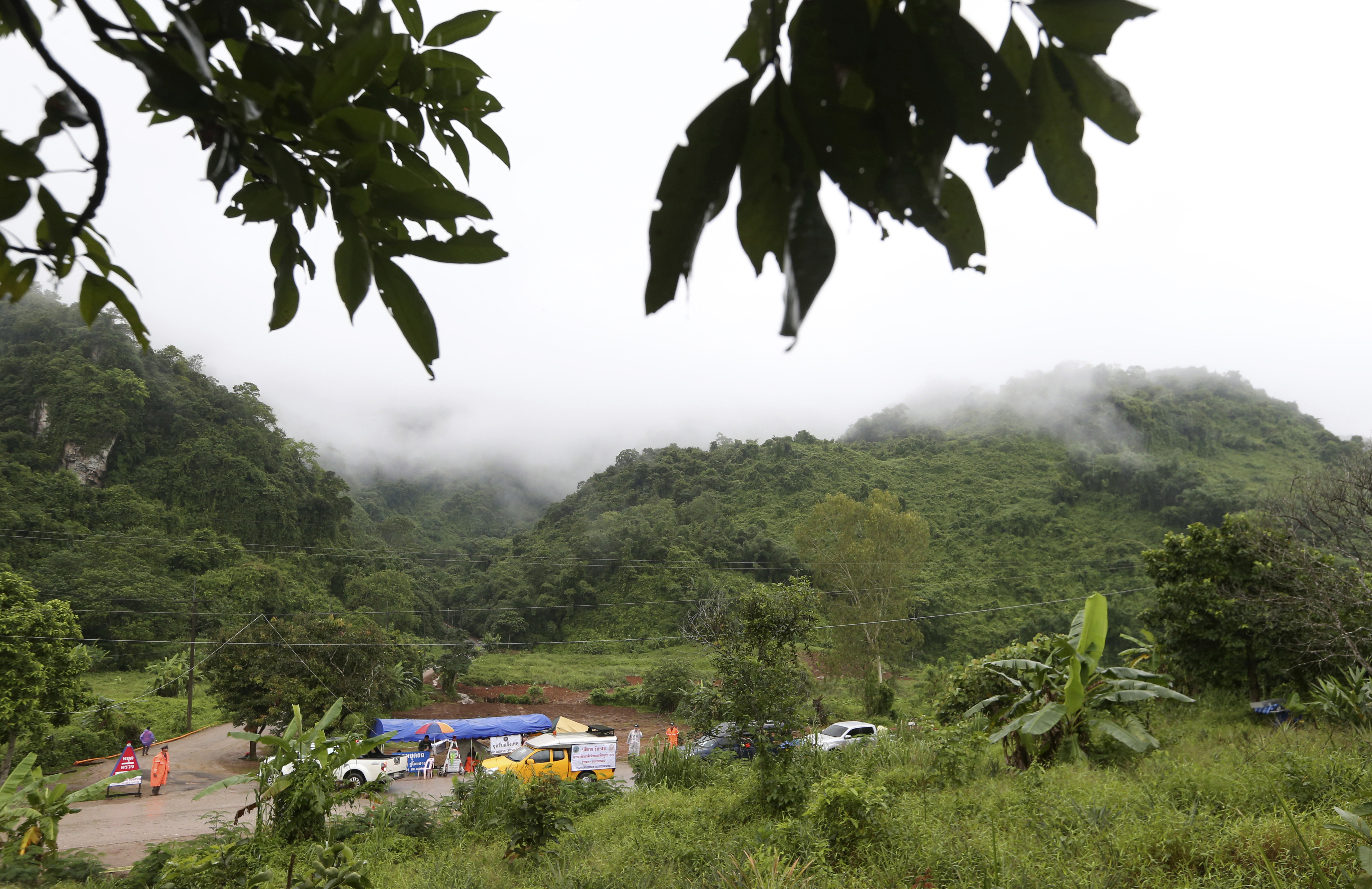 Vehicles at a checkpoint near the entrance to the cave complex in Thailand