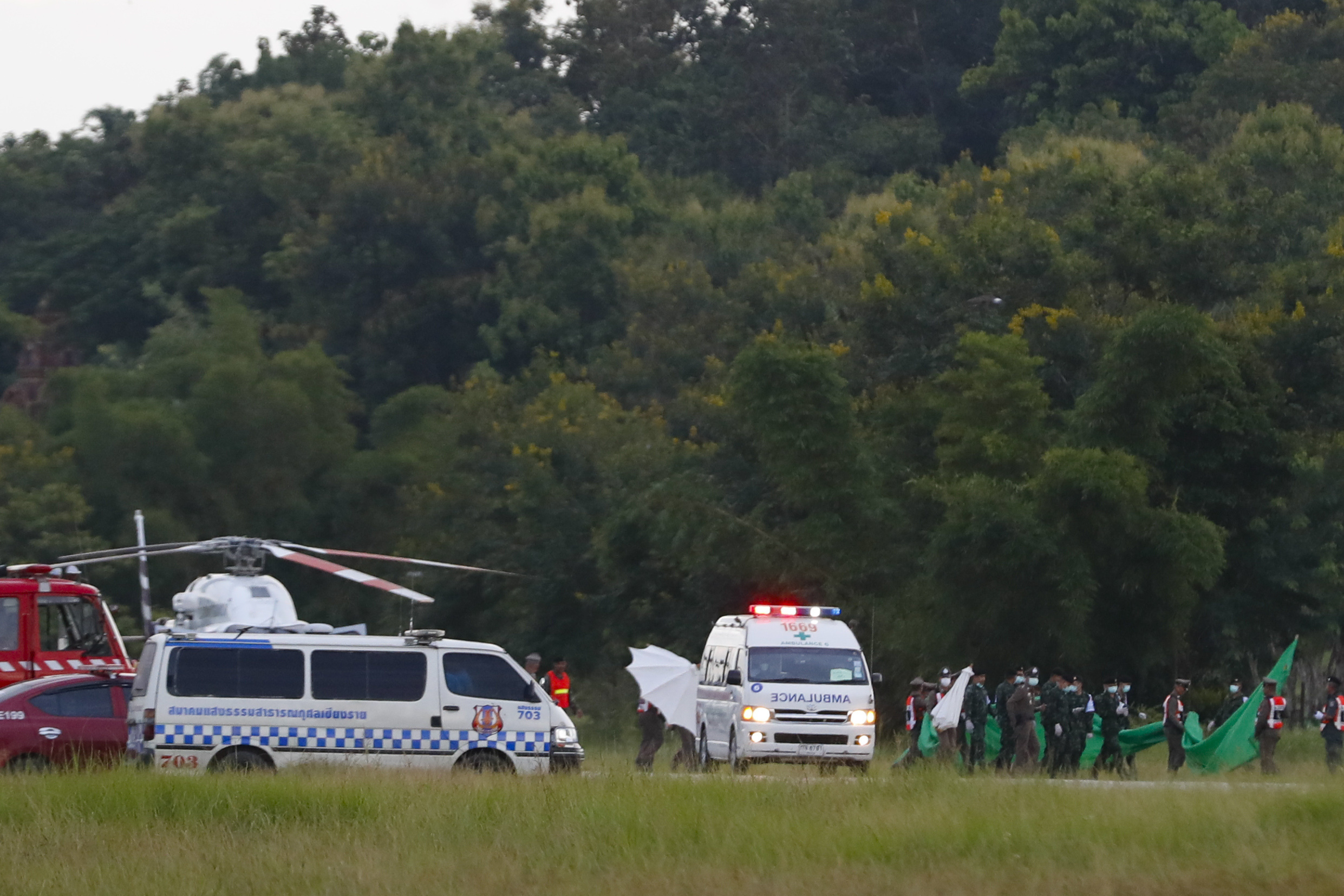 An ambulance believed to be carrying one of the rescued boys from the flooded cave in Thailand