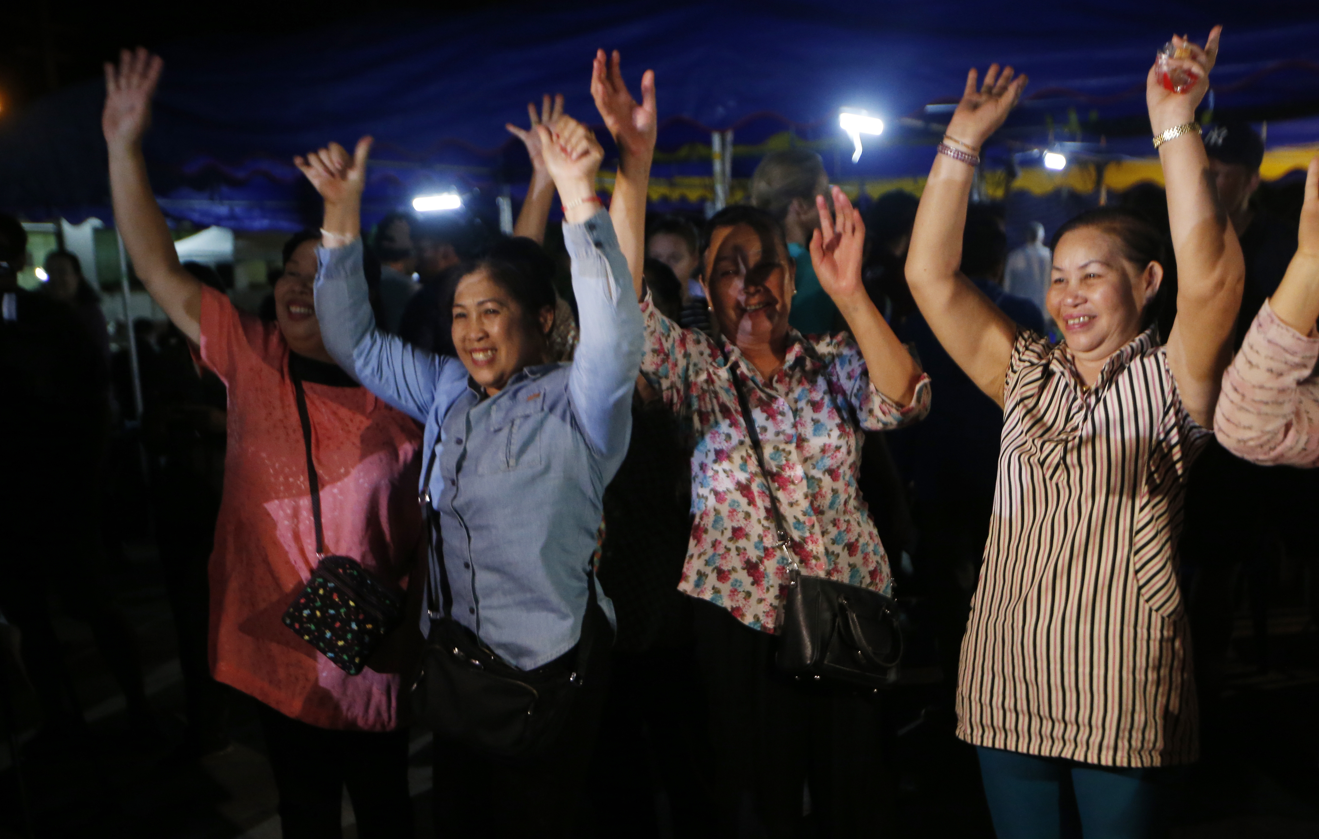 People celebrate after the evacuation in Chiang Rai