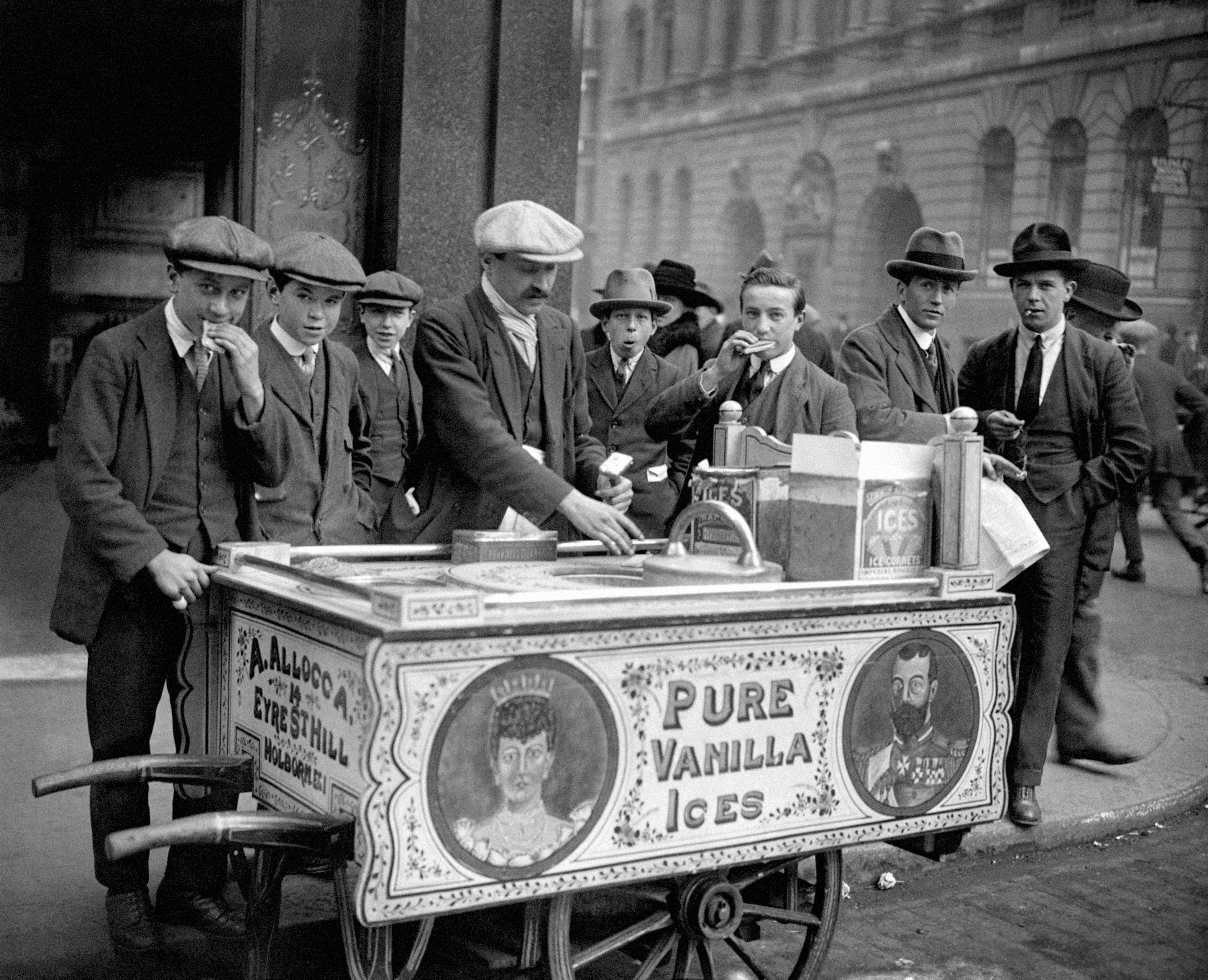 An Italian ice cream seller, Mr Allocca, and his patriotically decorated ice cream cart which displays images of King George V and Queen Mary, selling ice creams on the streets of London in 1921 (PA Archive)