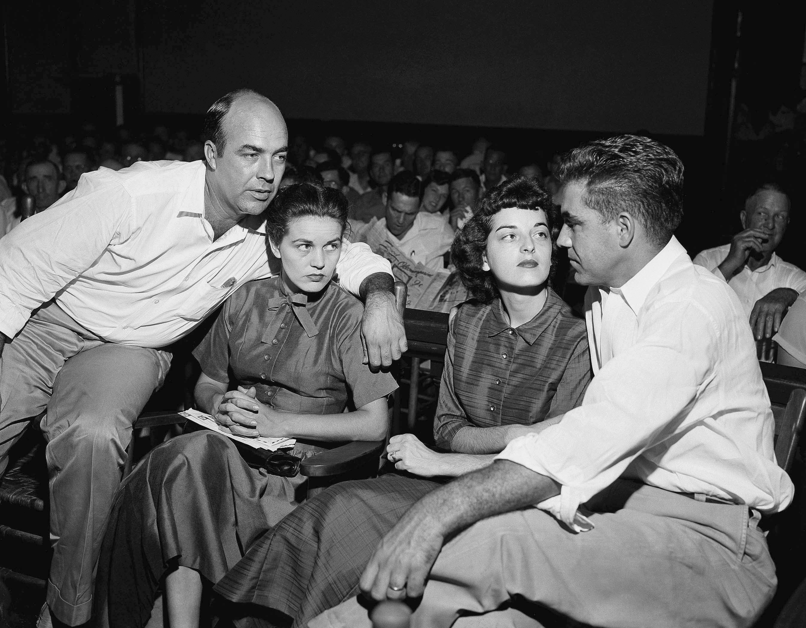 JW Milam, left, his wife, Roy Bryant, far right, and his wife Carolyn Bryant in a courtroom in Sumner, Mississippi 