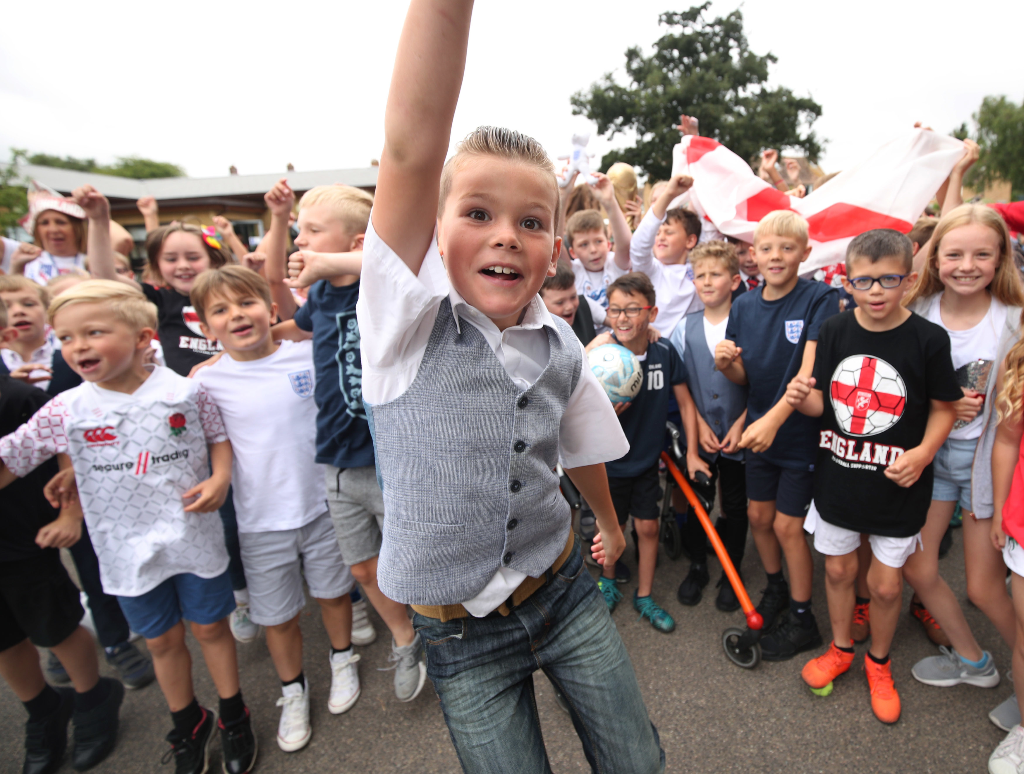 A kid in a waistcoat