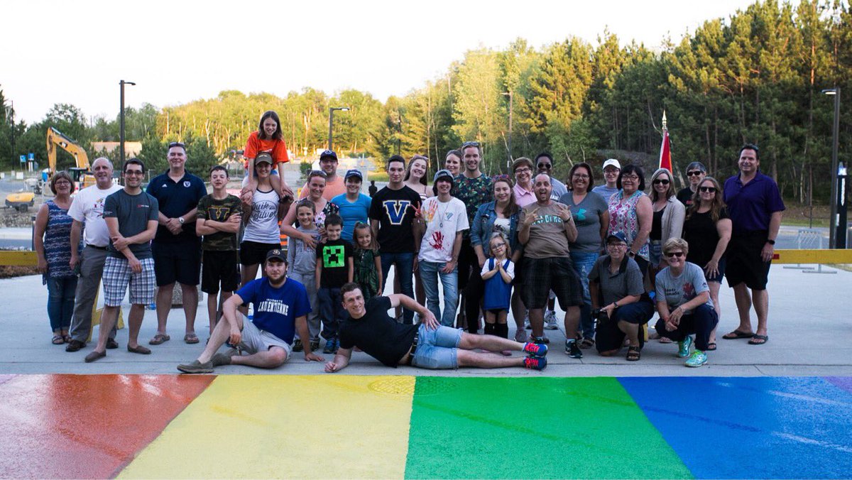 Pride flag being painted into a zebra crossing at Laurentian University (Laurentian University)