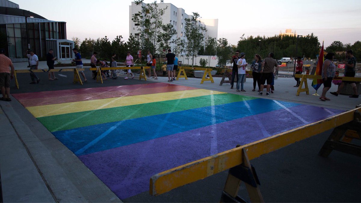 Pride flag being painted into a zebra crossing at Laurentian University (Laurentian University)