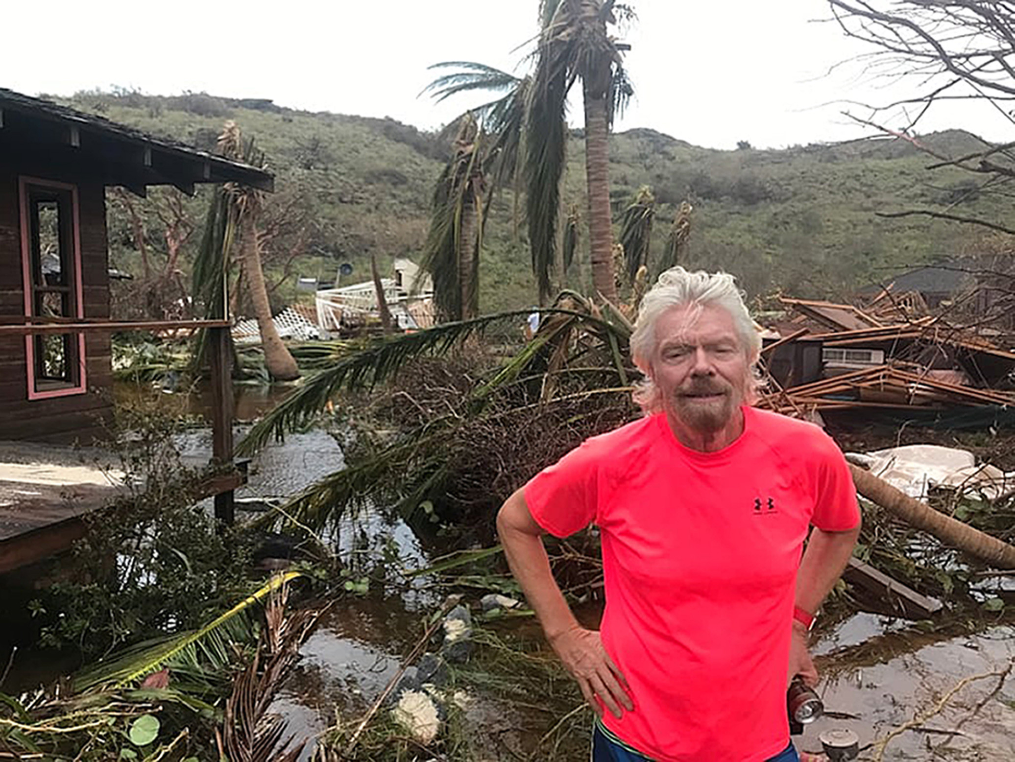 Sir Richard Branson amongst the debris on his private island Necker caused by Hurricane Irma in September 2017 (Branson Family/PA)