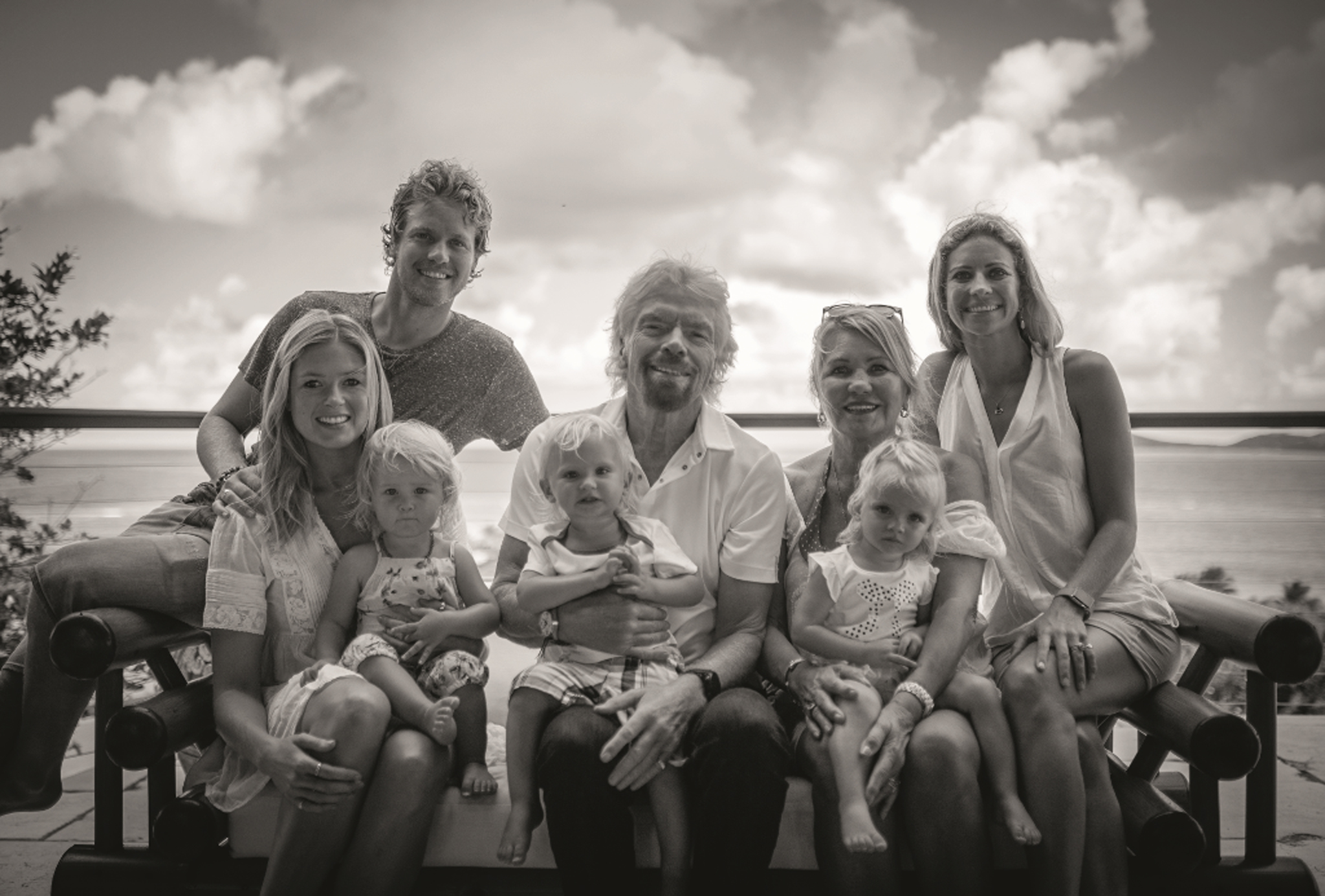 Richard with his wife, Joan, son Sam (L) daughter in law, Isabella, and daughter, Holly, (far right), and grandchildren. (Branson Family/Penguin/PA