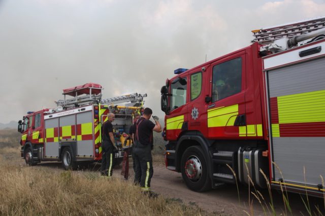 Crews tackle a blaze in Thurcroft, Rotherham, as high temperatures cause an increase in outdoor fires