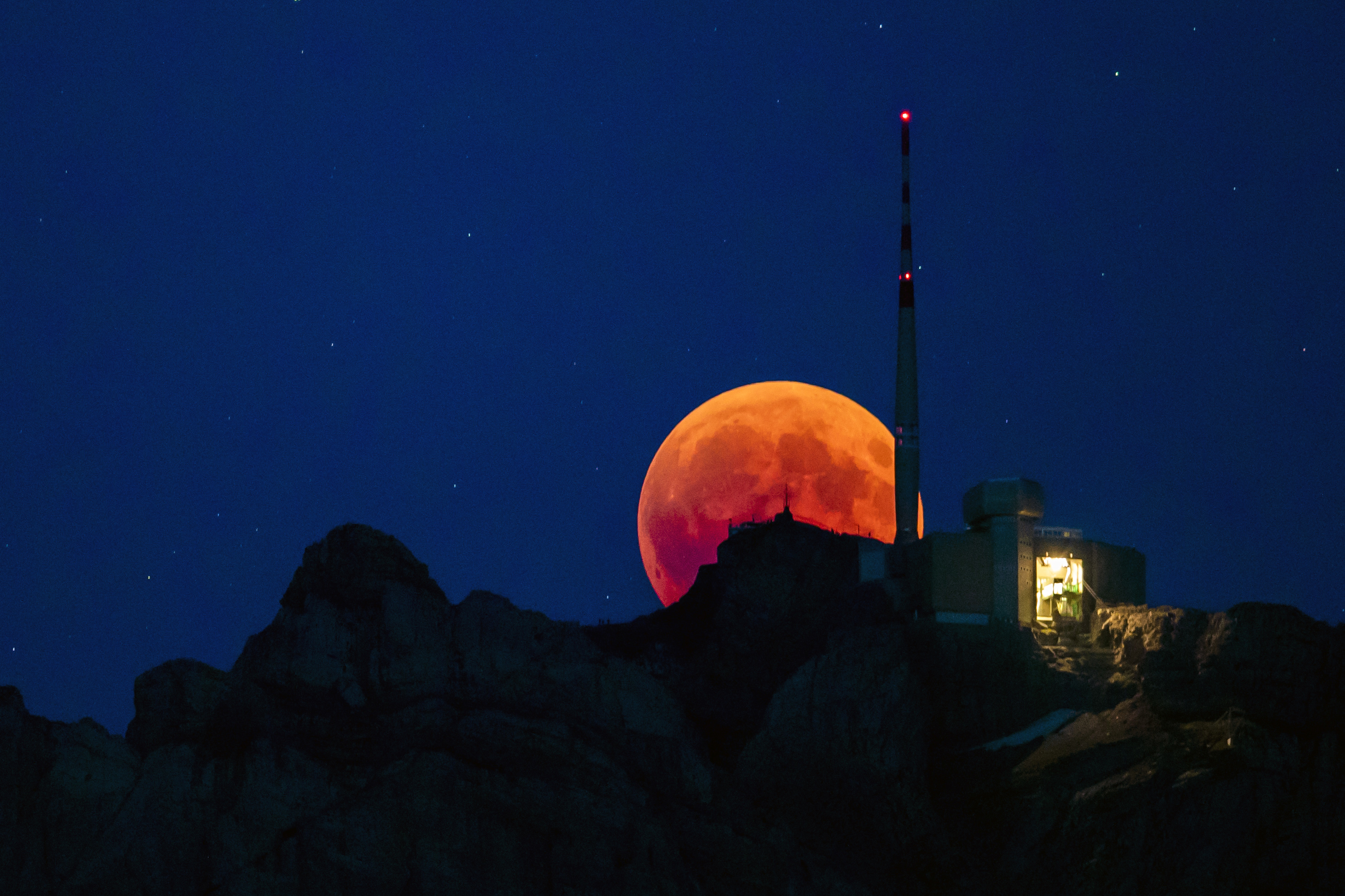 The moon turns red during a total lunar eclipse in Switzerland