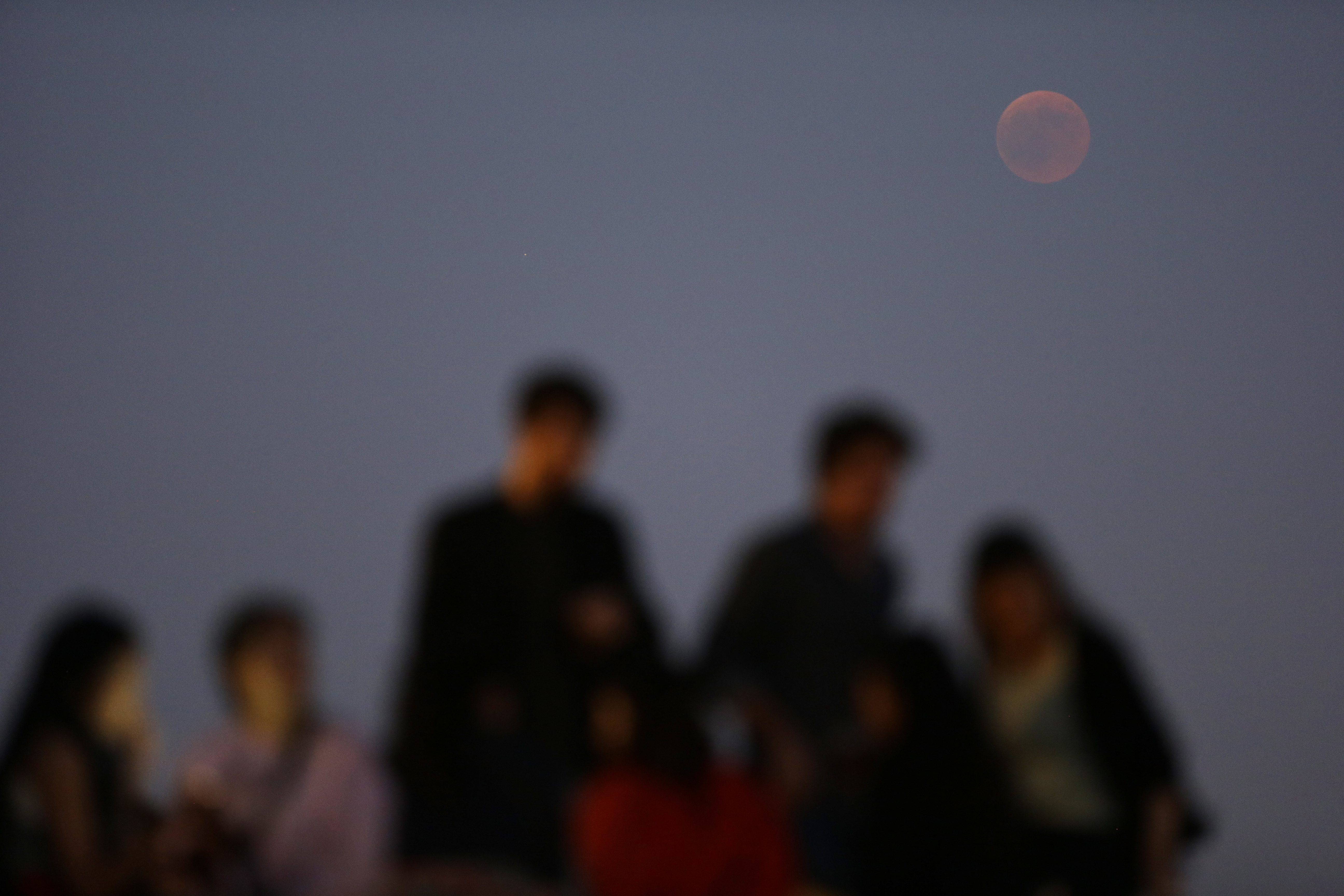 People during a lunar eclipse in Portugal