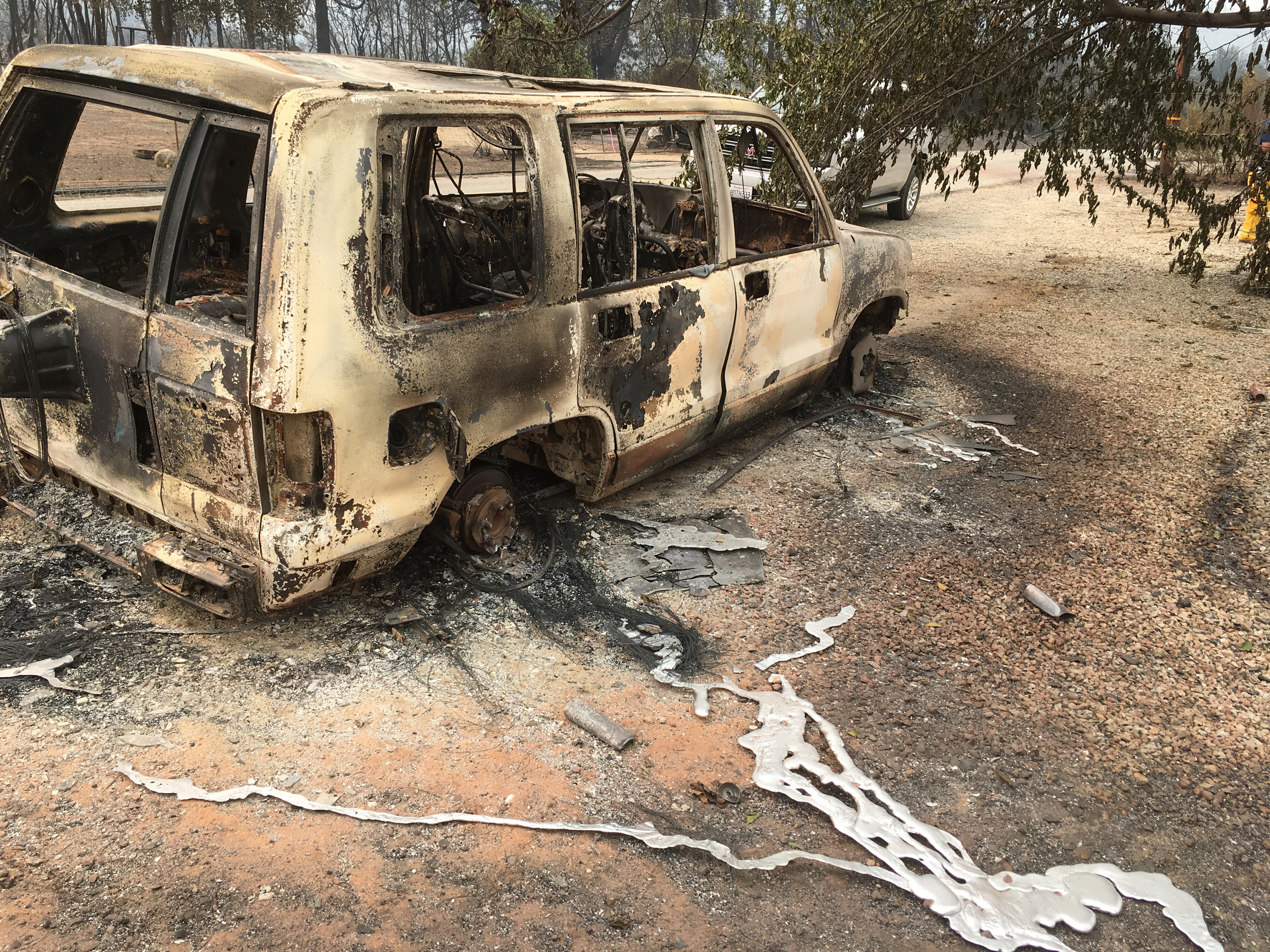 A burned vehicle in the mountain community of Keswick, California