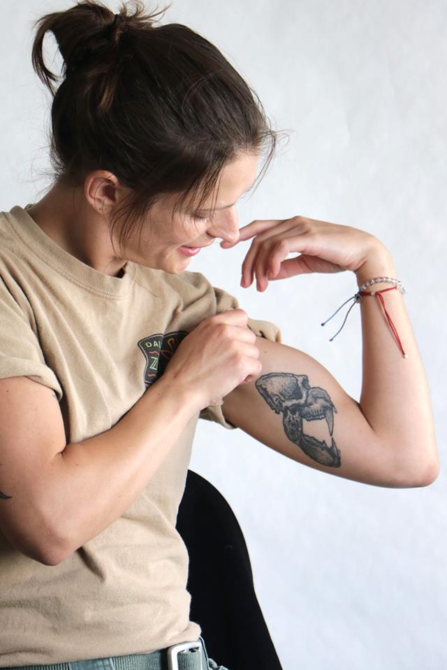 Zookeeper Annie shows her mandrill skull tattoo