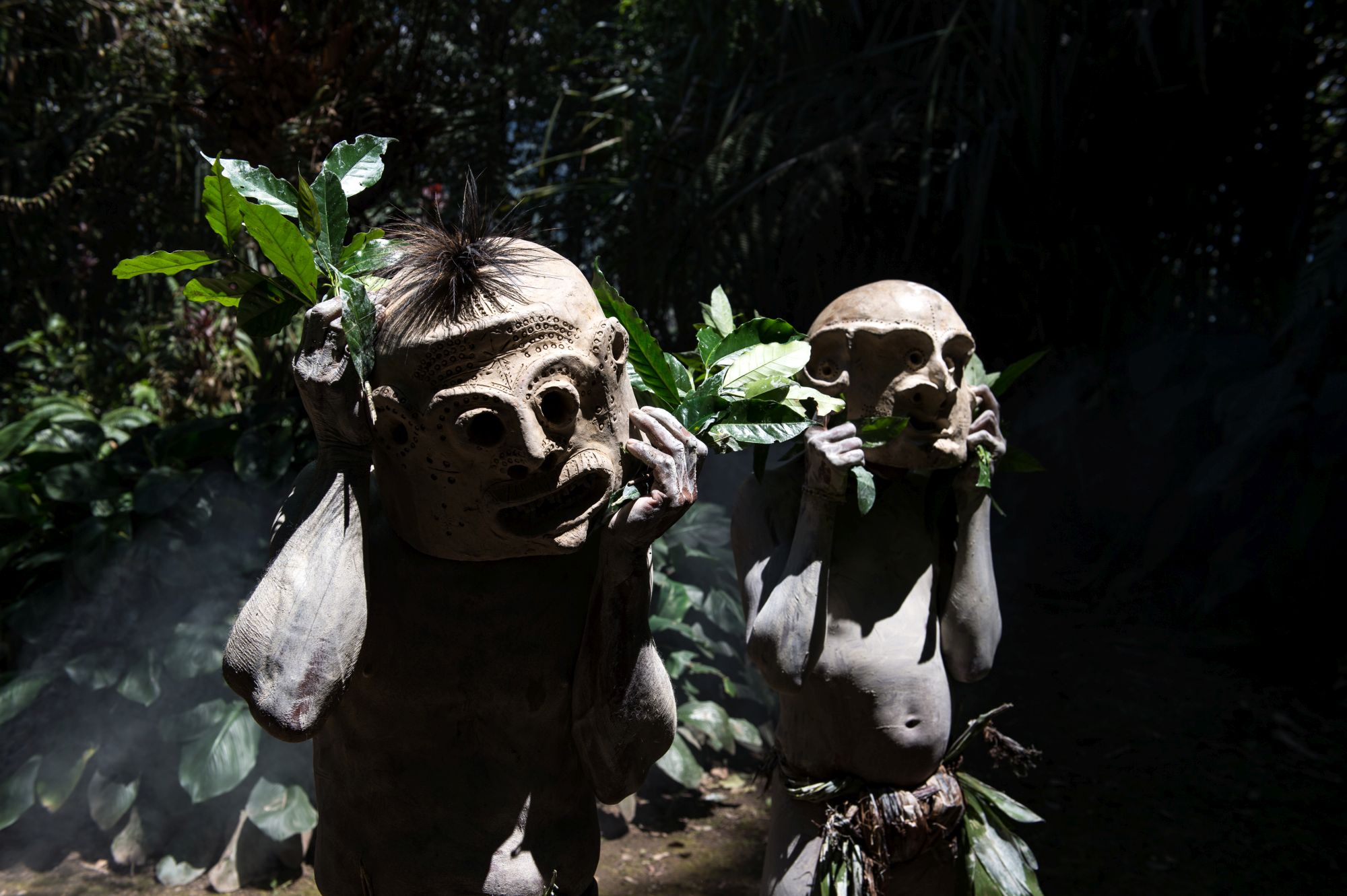 The mudmen dance under the weight of clay masks (Renato Granieri/PA)