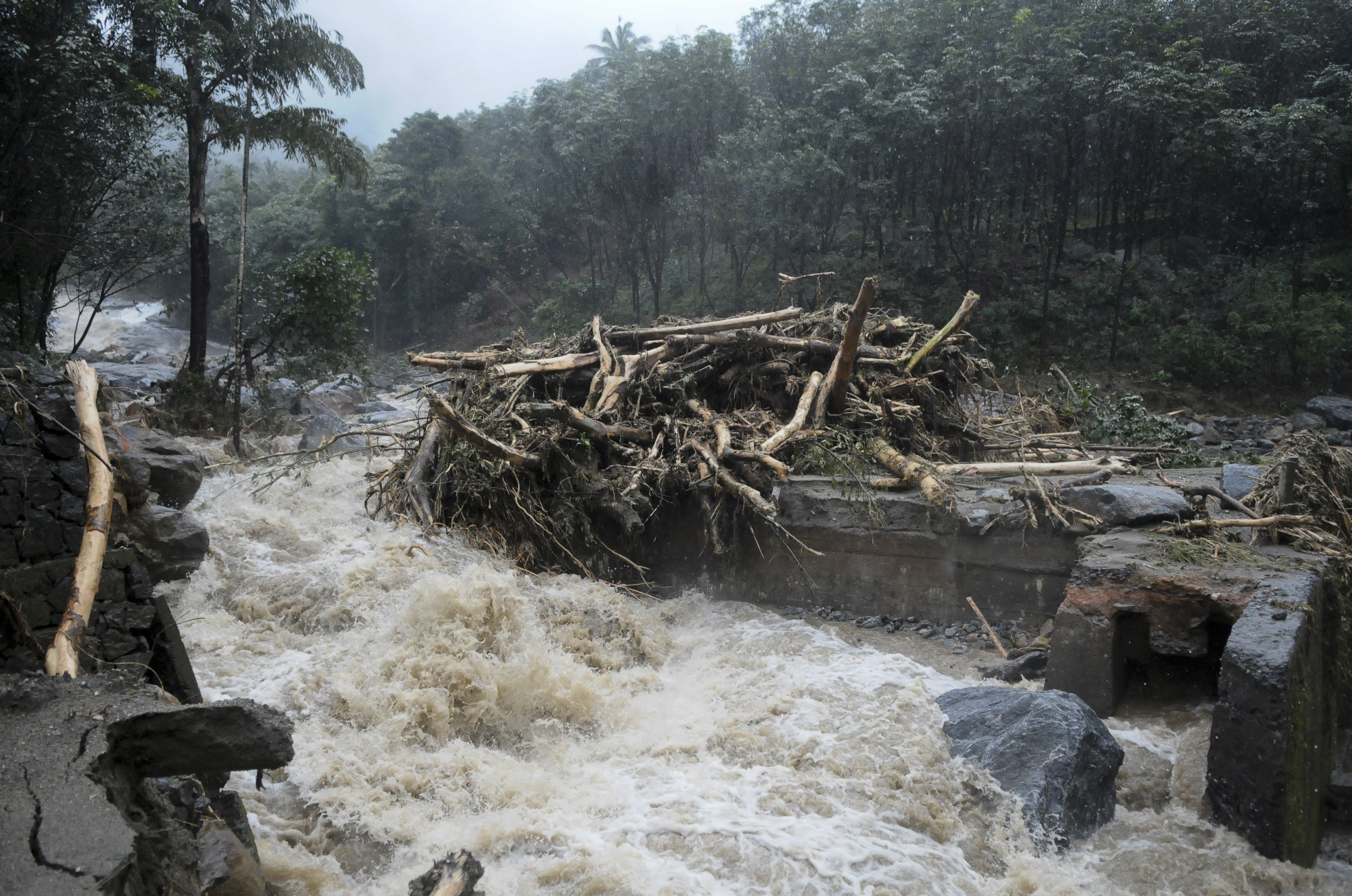 Water gushes out following heavy rain in Kozhikode, Kerala state, India
