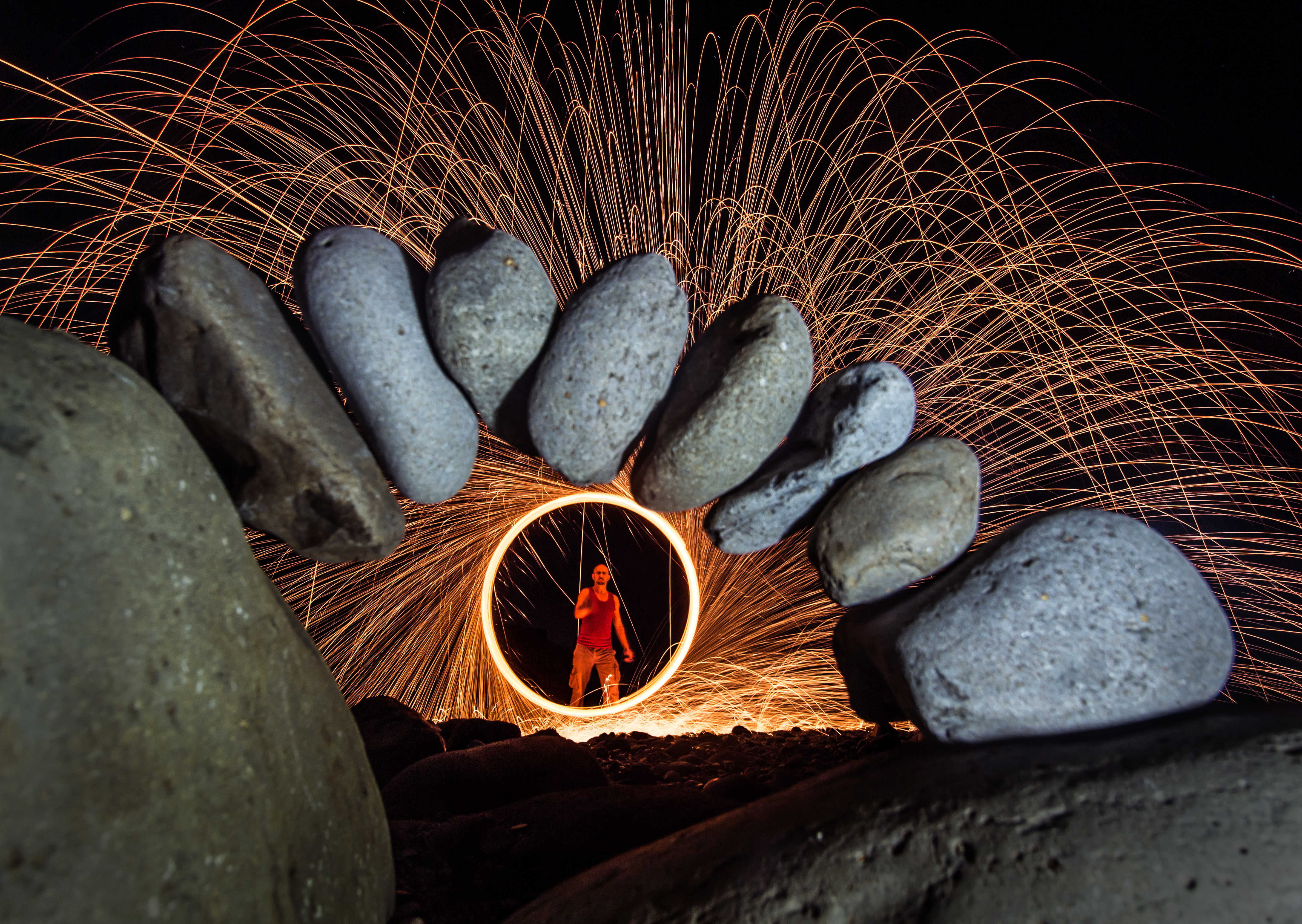 Rod behind an arch of stones