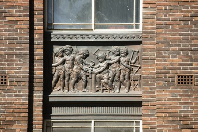 Panels on the old Raleigh headquarters building show its role in bicycle manufacture (Historic England/PA)