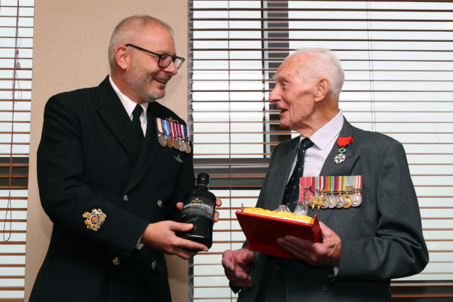 Harry Johnson given bottle of whisky