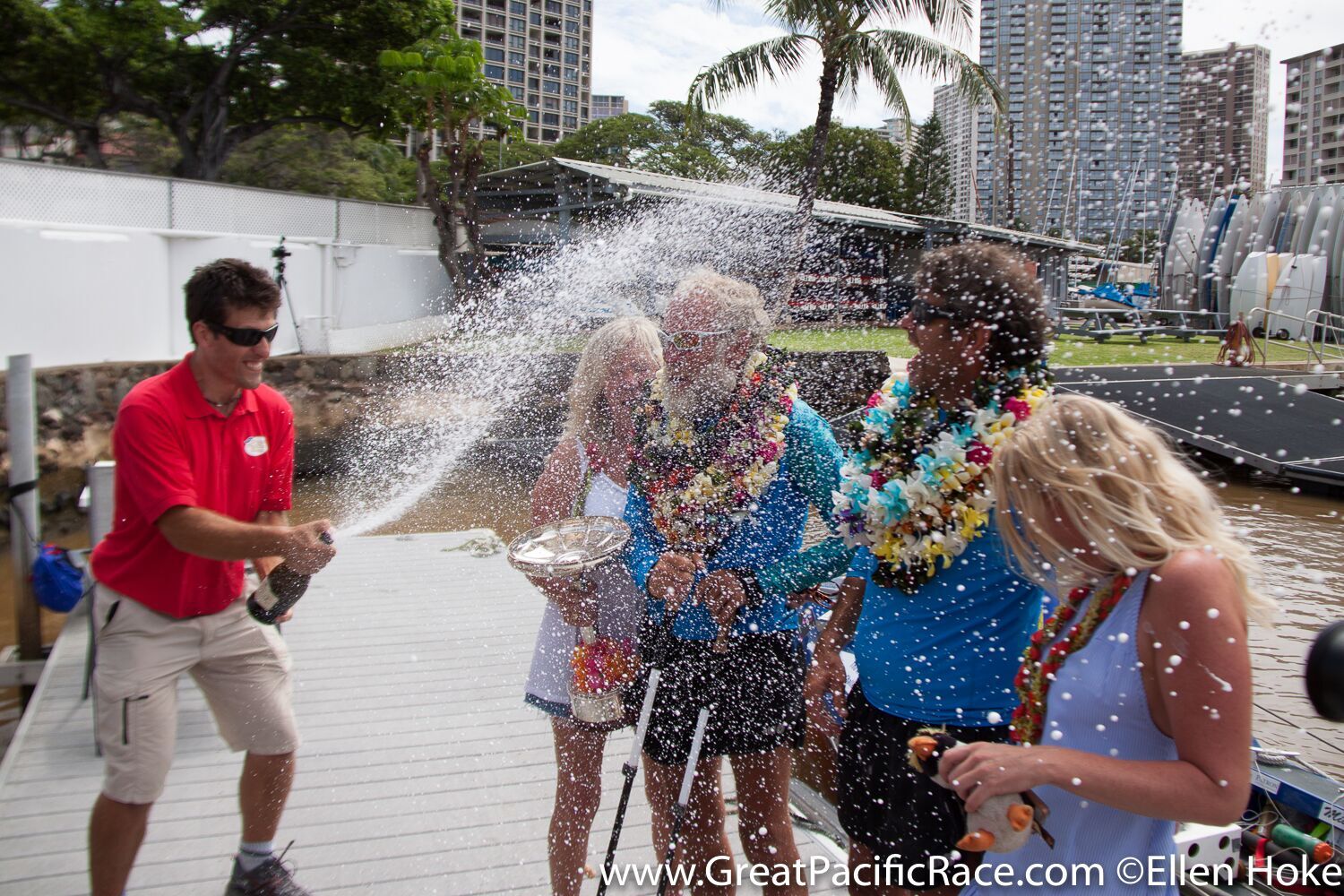 Steve Sparkes and Mick Dawson celebrating at the race finish in Honolulu, Hawaii